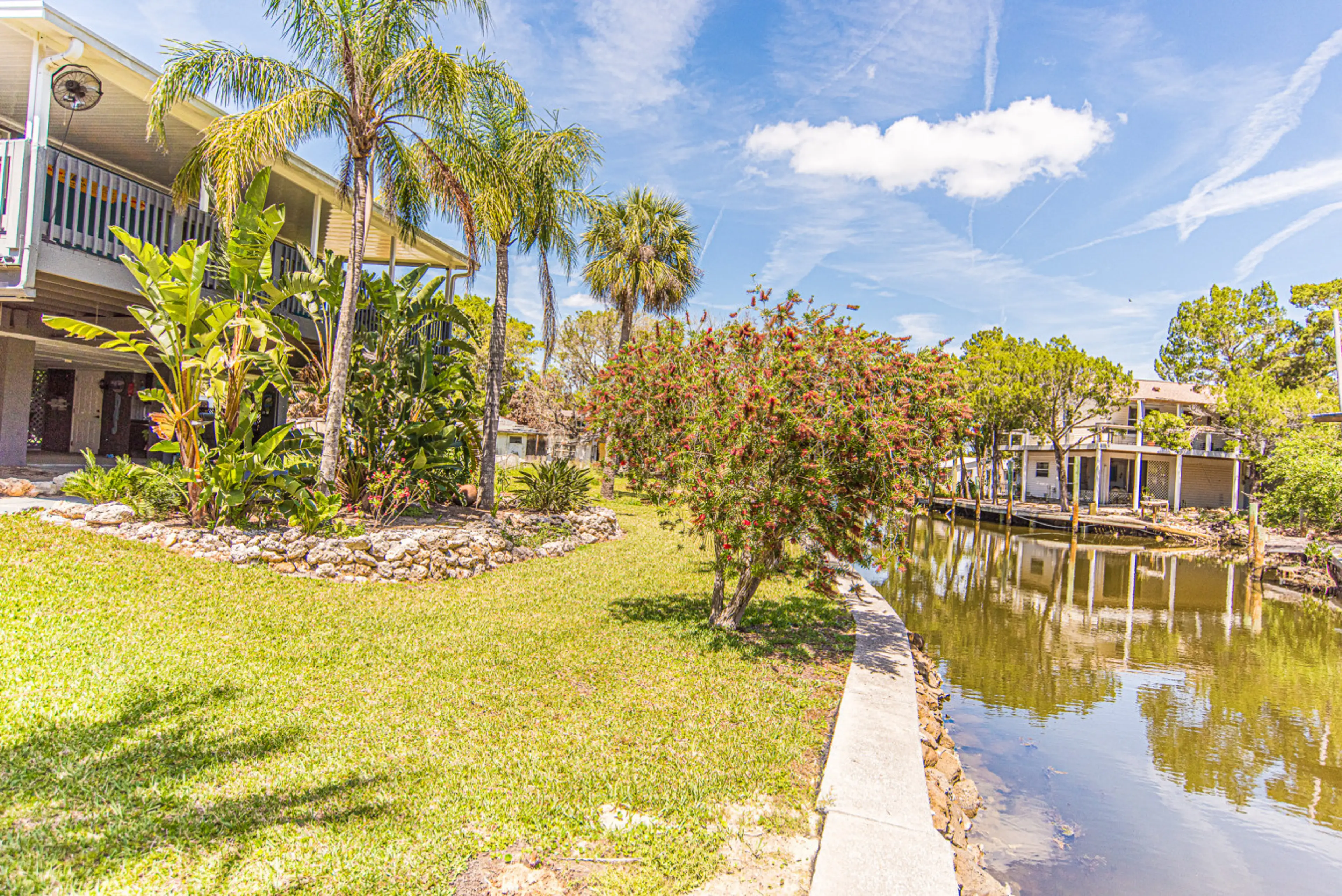 Canal front with firepit, boat dock, fish station and so much more!