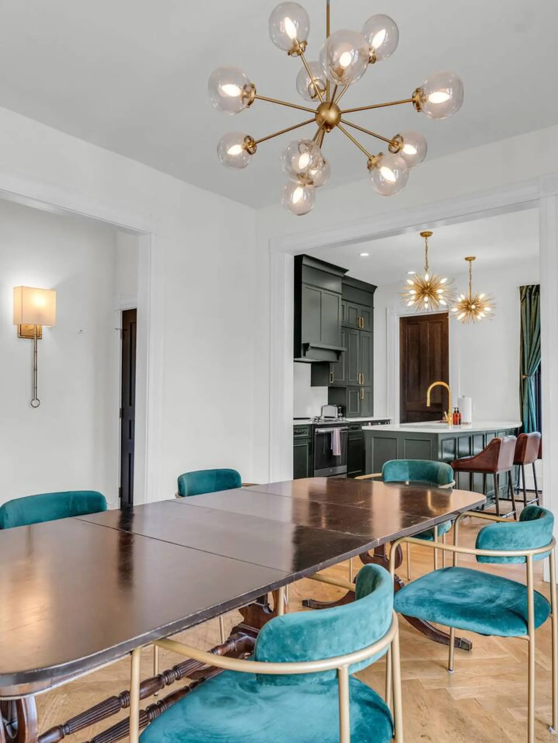 Dining Room: Elegant dining space with vibrant chairs and chic lighting for memorable meals!