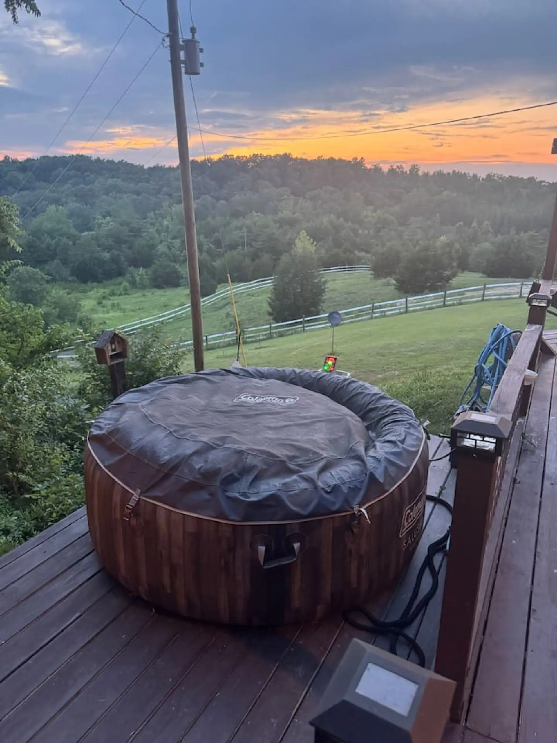 Relax and unwind in the private hot tub while taking in the beautiful valley views.