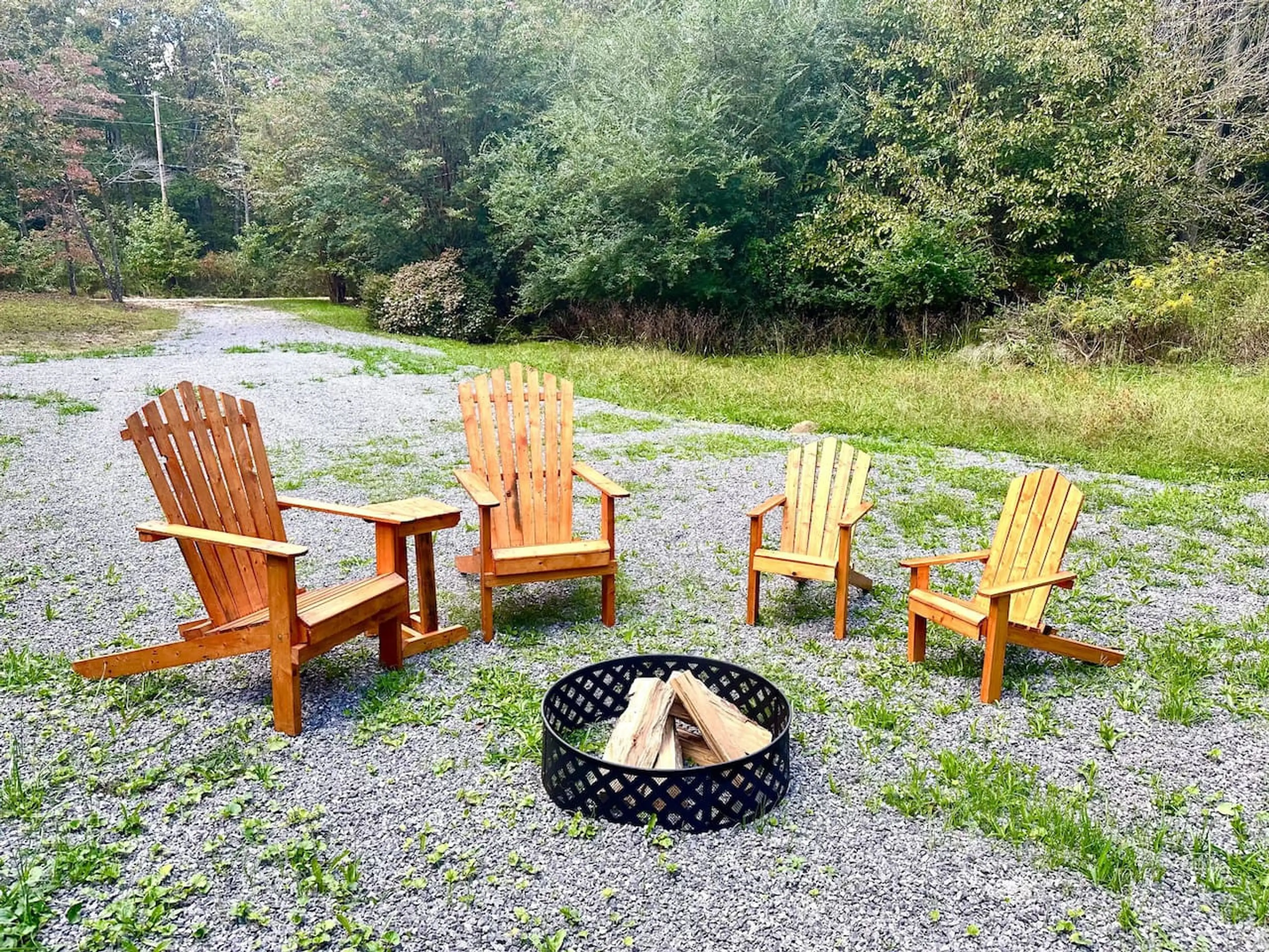 Firelight, fresh air, and Adirondack comfort—your perfect retreat. (Wood not provided, please bring your own supply)