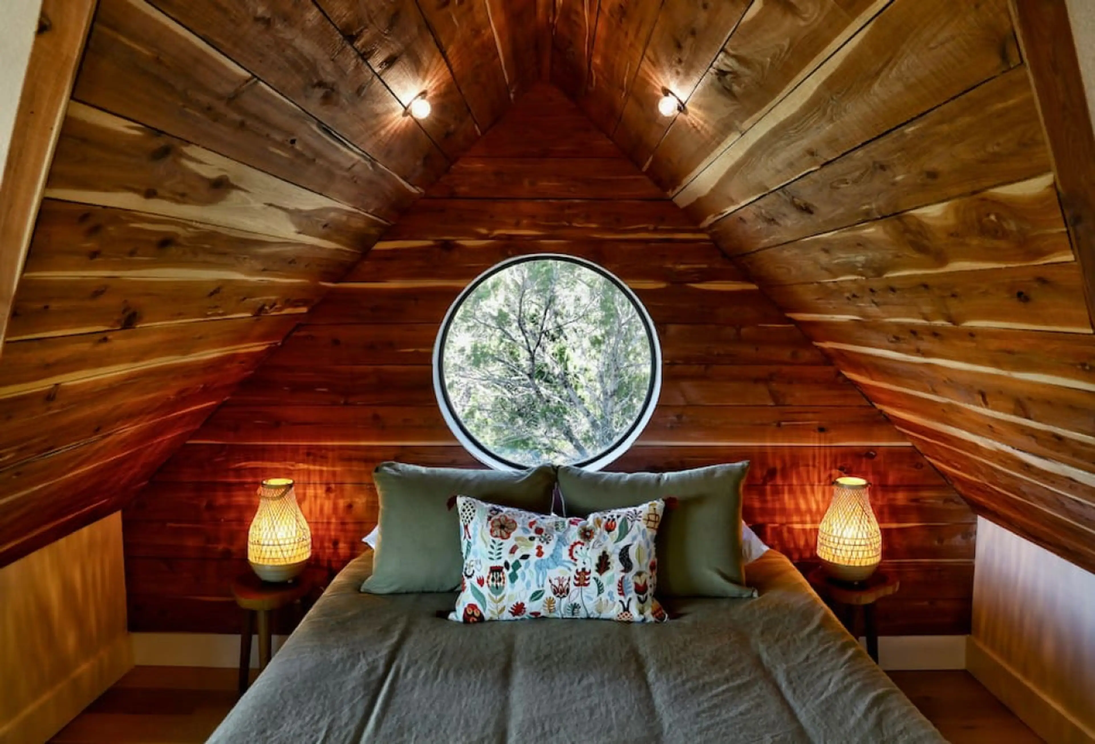 The Lazy Lavender Treehouse in Wimberley Texas — Cedar-Lined Sleeping Loft with Round Window and Treetop Views