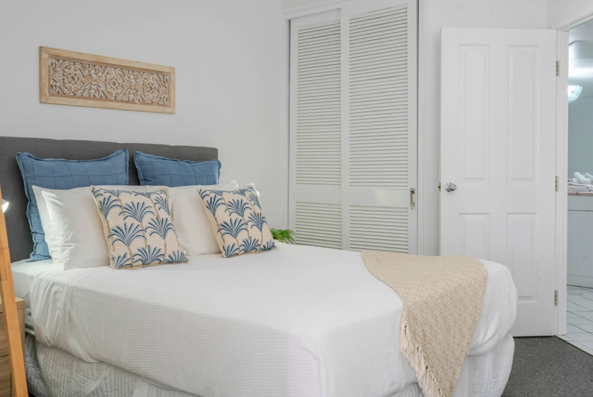 Inviting bedroom with queen bed and soothing coastal style