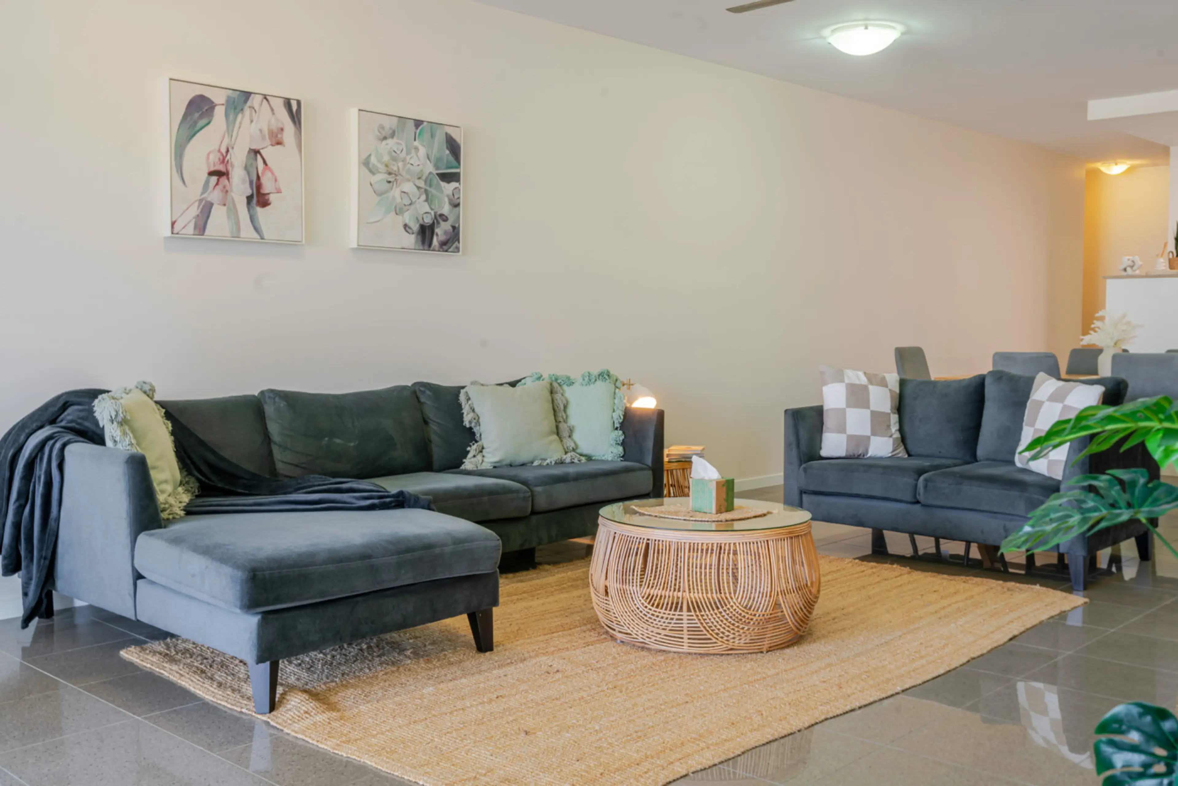 Step into the welcoming living area, where modern design and comfort come together to create the perfect space to relax. The open-plan layout flows seamlessly into the fully equipped kitchen, featuring sleek appliances and ample counter space for all your