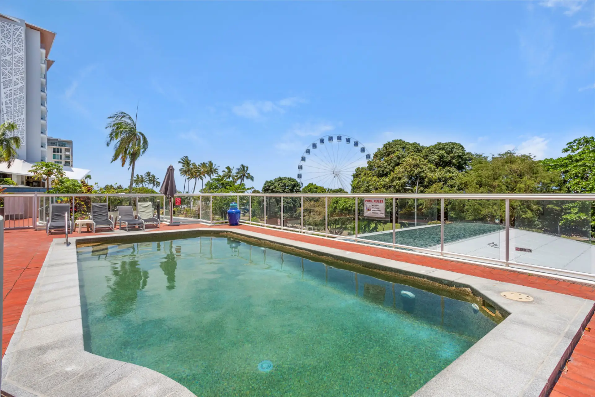 Poolside Oasis: Dive into relaxation with stunning Esplanade views and tropical vibes!