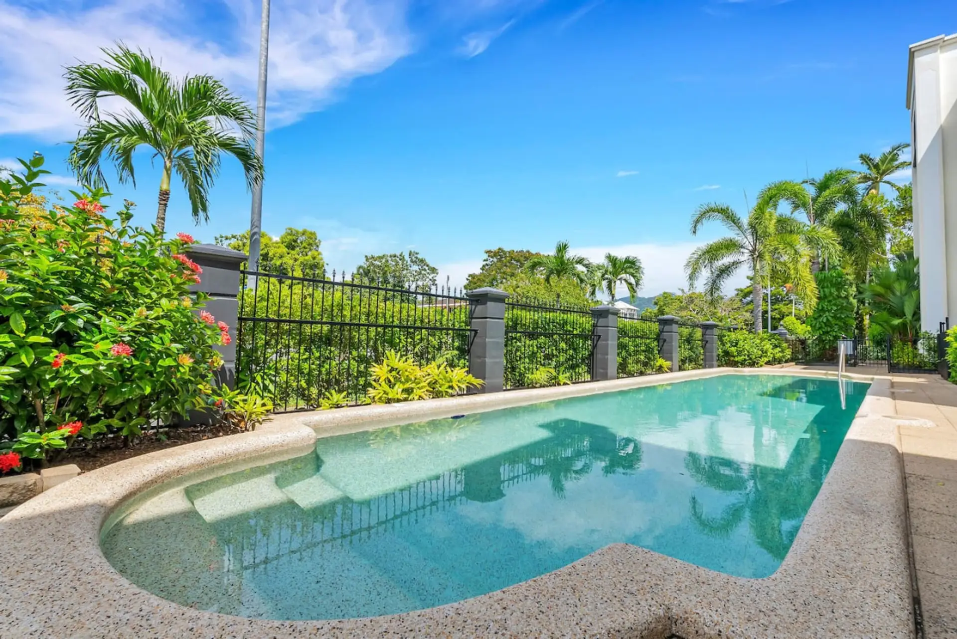 Tropical Oasis: Dive into relaxation in your private pool surrounded by lush greenery!