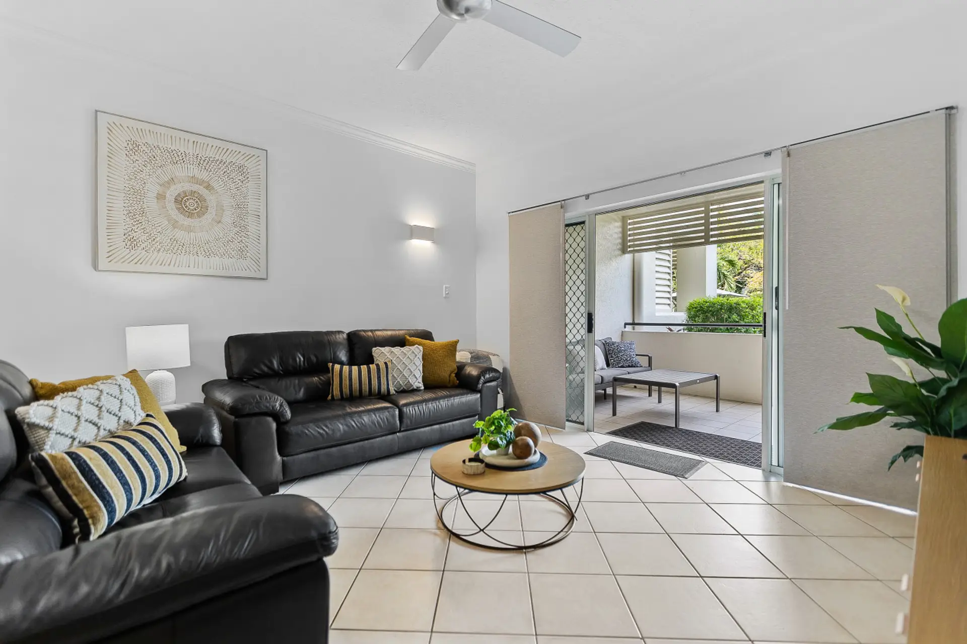 Spacious living room with terrace access.
