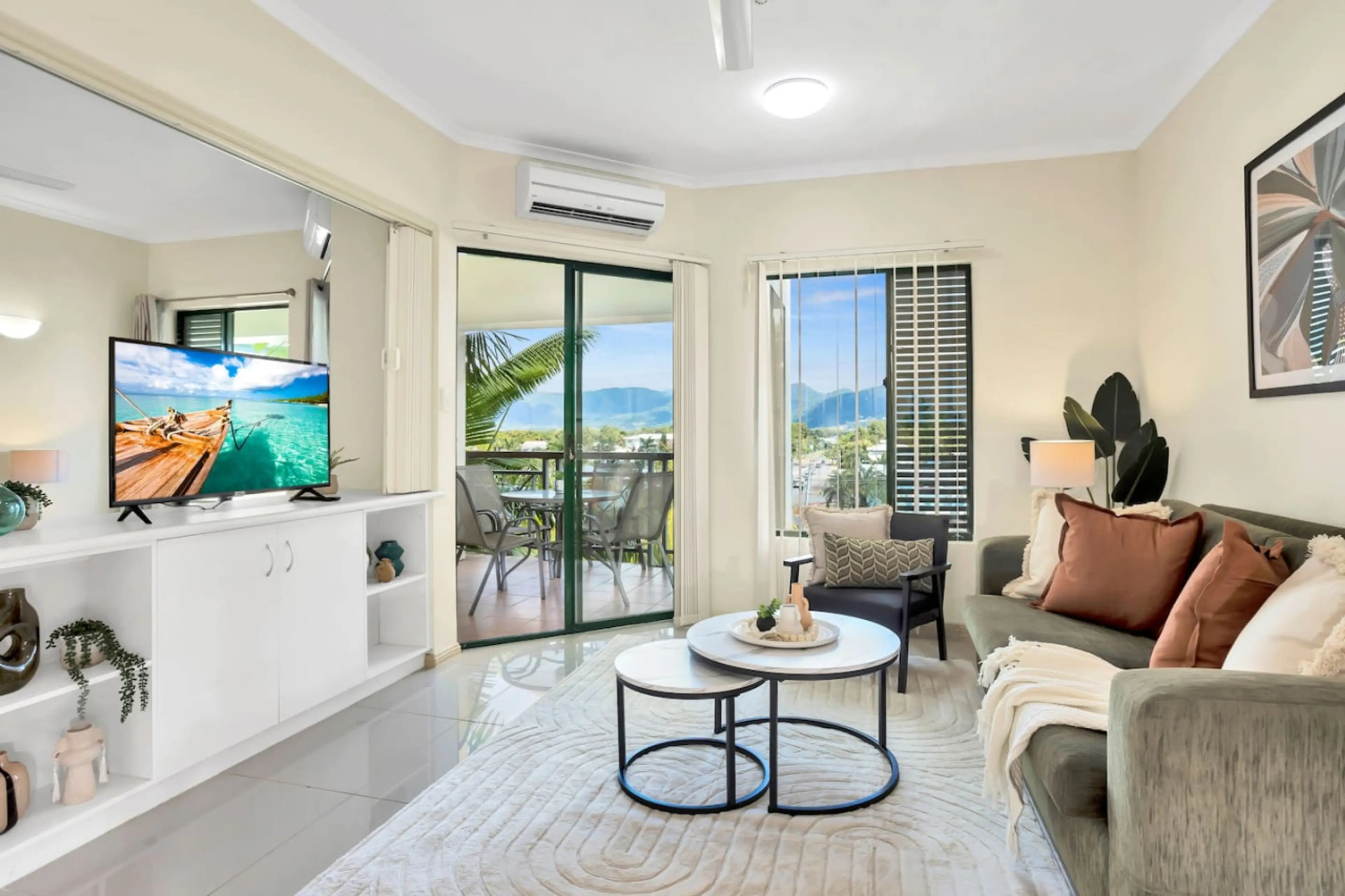 Relax in style in this cozy, sunlit living room — the perfect spot to unwind after a day exploring the city. Modern comfort just minutes from downtown