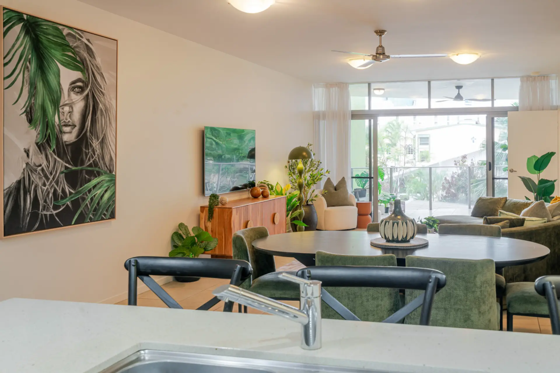 Spacious living and dining area filled with natural light and elegant design touches