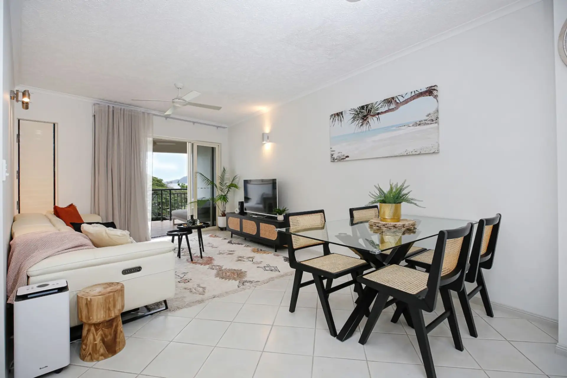 Comfortable dining area with seating for four, perfect for enjoying meals with family or friends. Bright and airy space with natural light, located just off the kitchen and living room — ideal for relaxed dining during your Cairns stay.