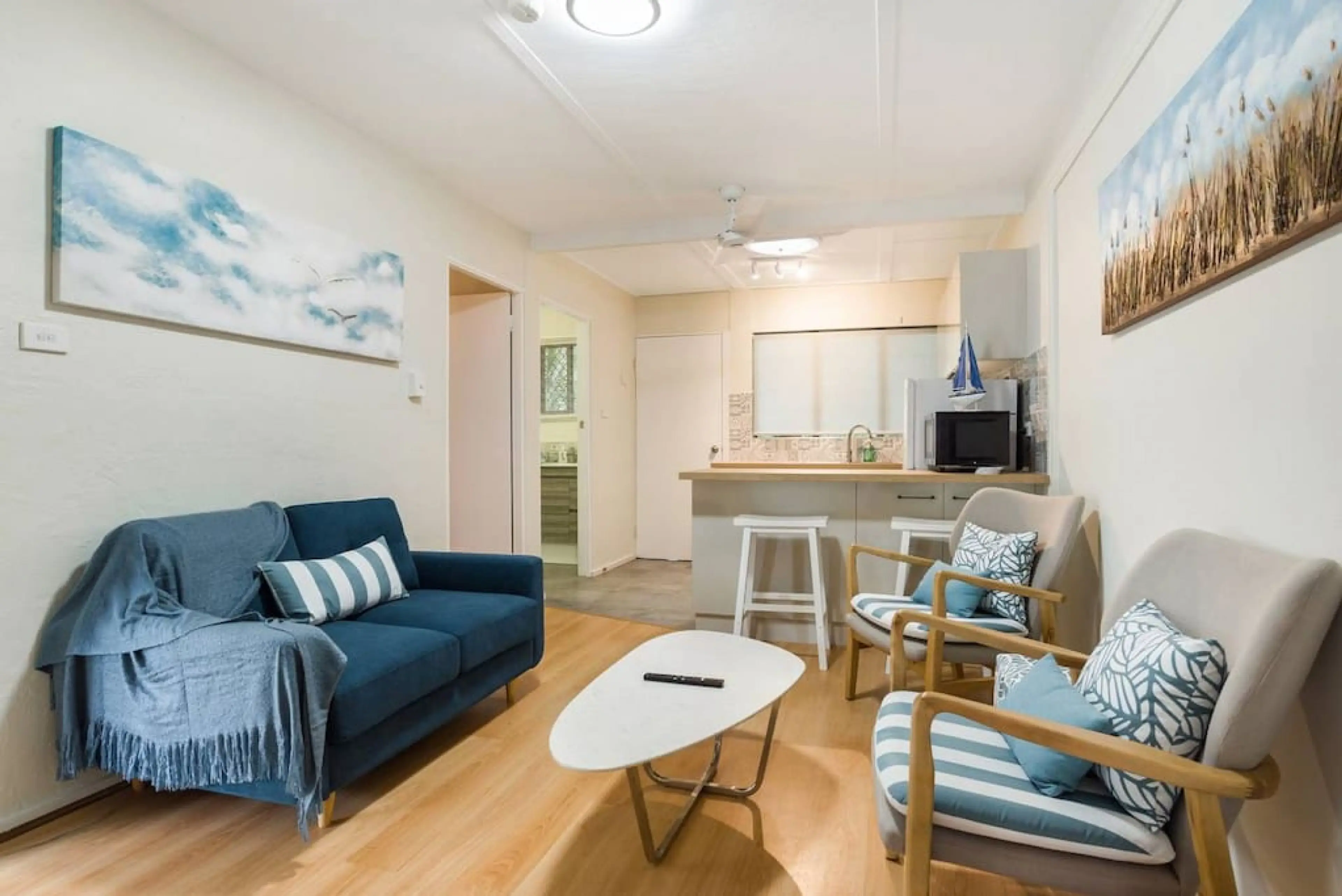 Living Area: Bright and airy retreat with stylish seating and open kitchen for unforgettable gatherings