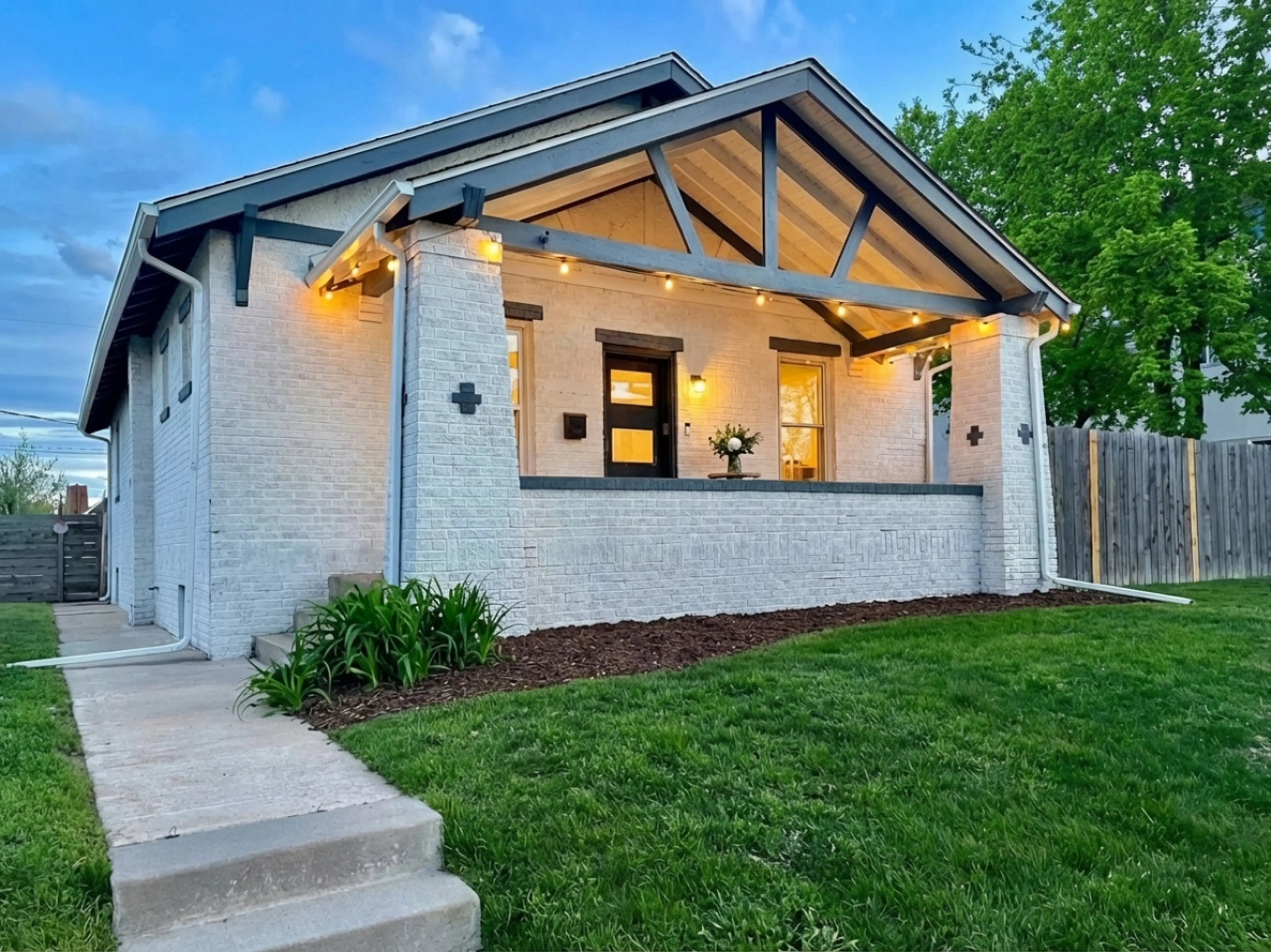 Charming 6BR Denver Highlands bungalow -- covered porch with string lights, perfect for groups