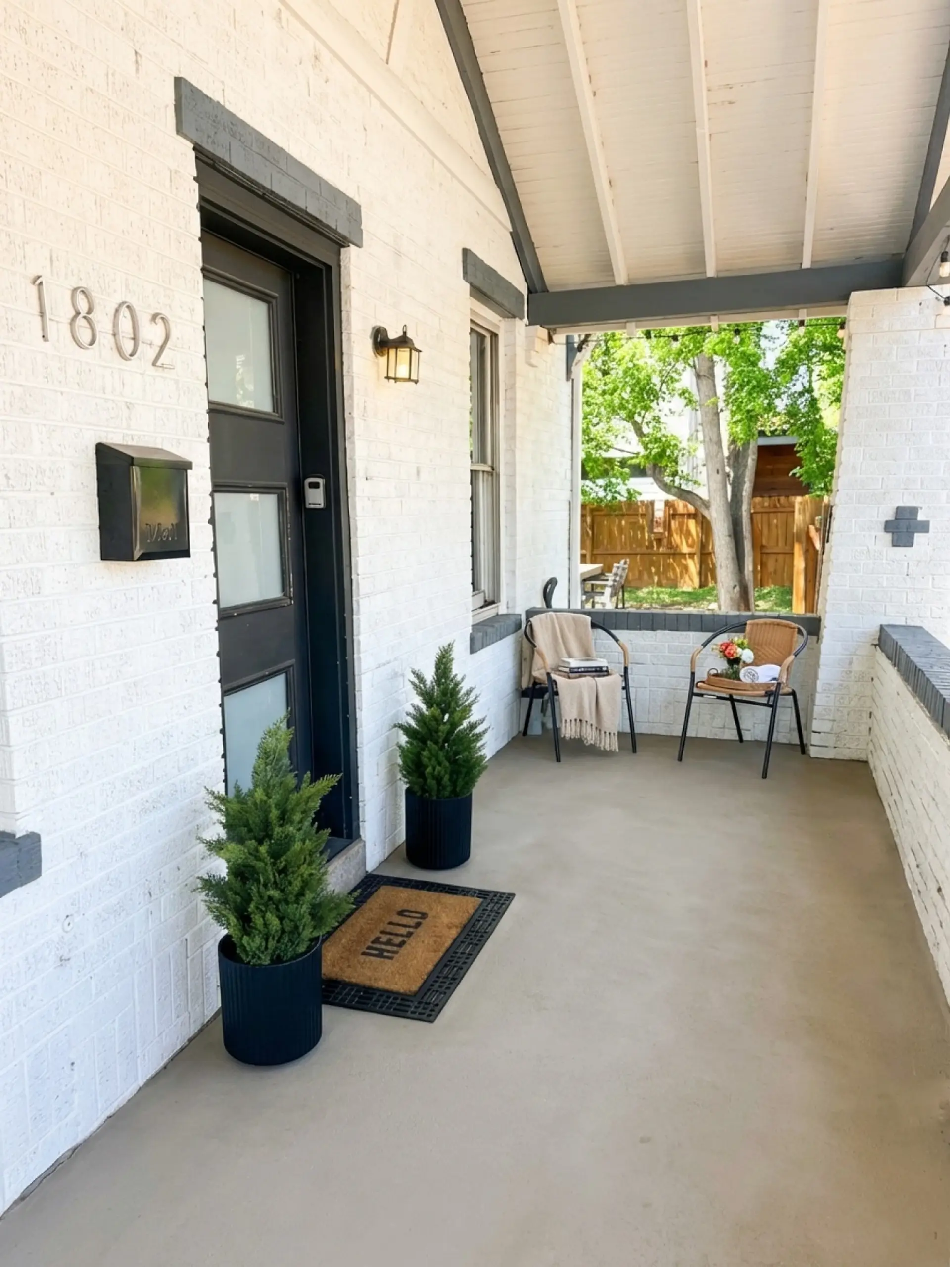 Welcoming front porch seating with smart lock keyless entry -- Denver Highlands vacation rental