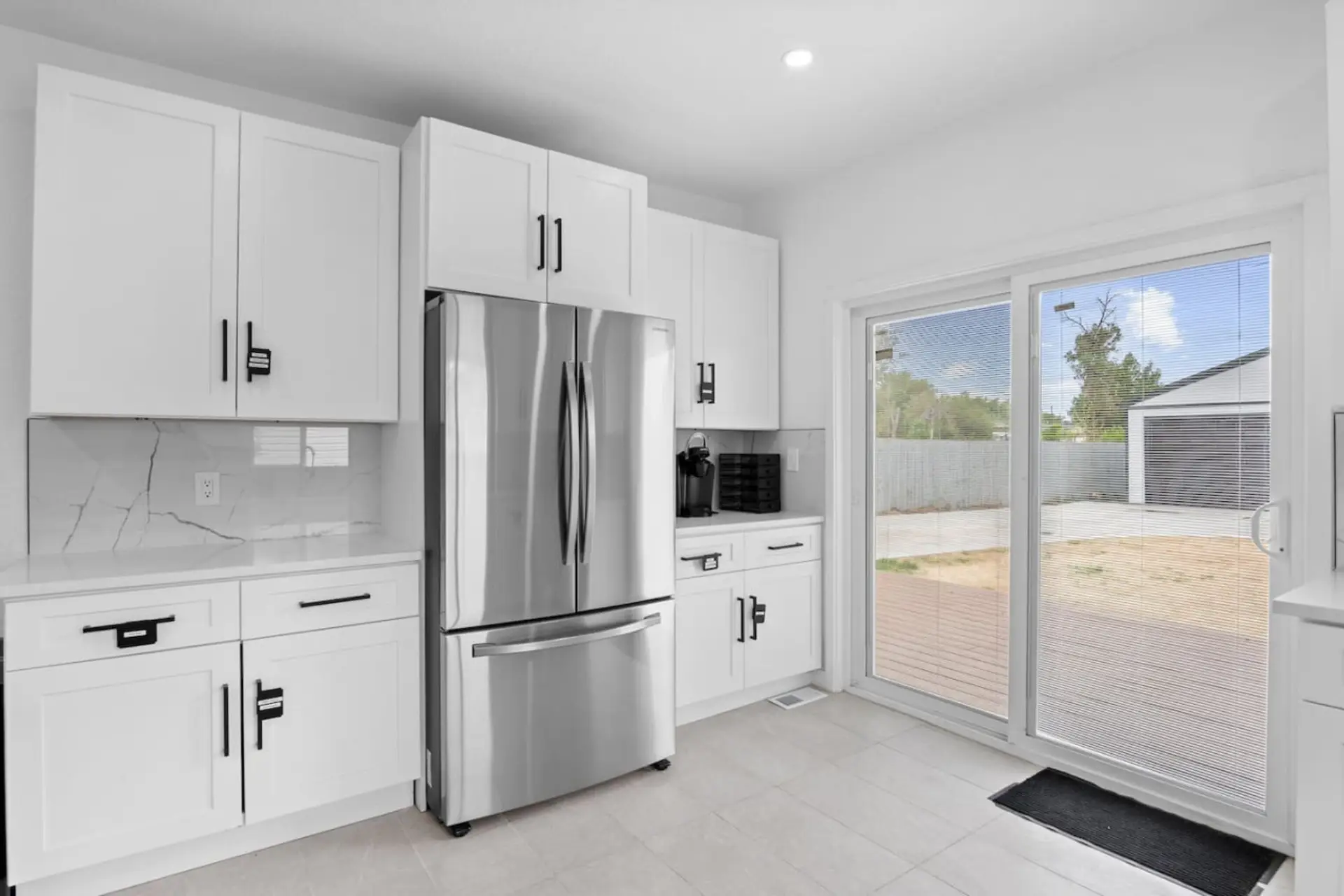 Fully Equipped Kitchen | Cooking Basics Includes stainless steel appliances and backyard access.