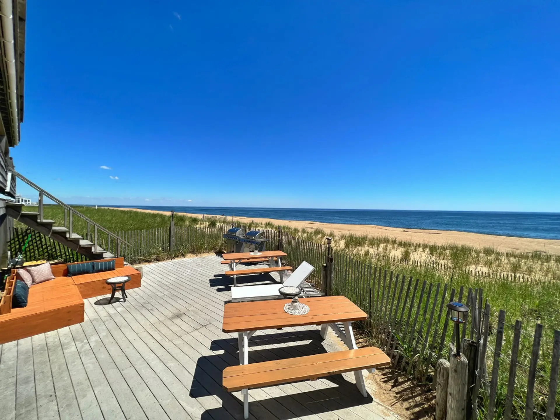 A private oceanfront deck offering stunning views and direct access to the beach.