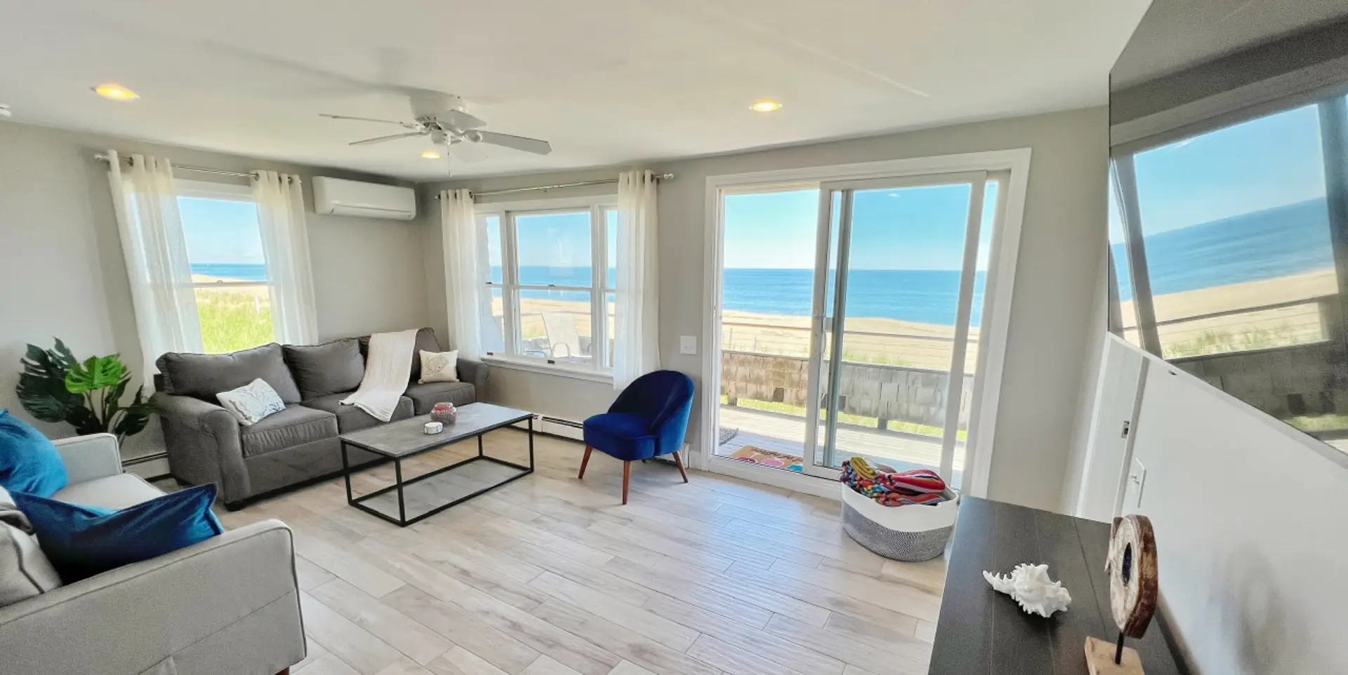 A welcoming living area offering stunning views and a comfortable coastal atmosphere.