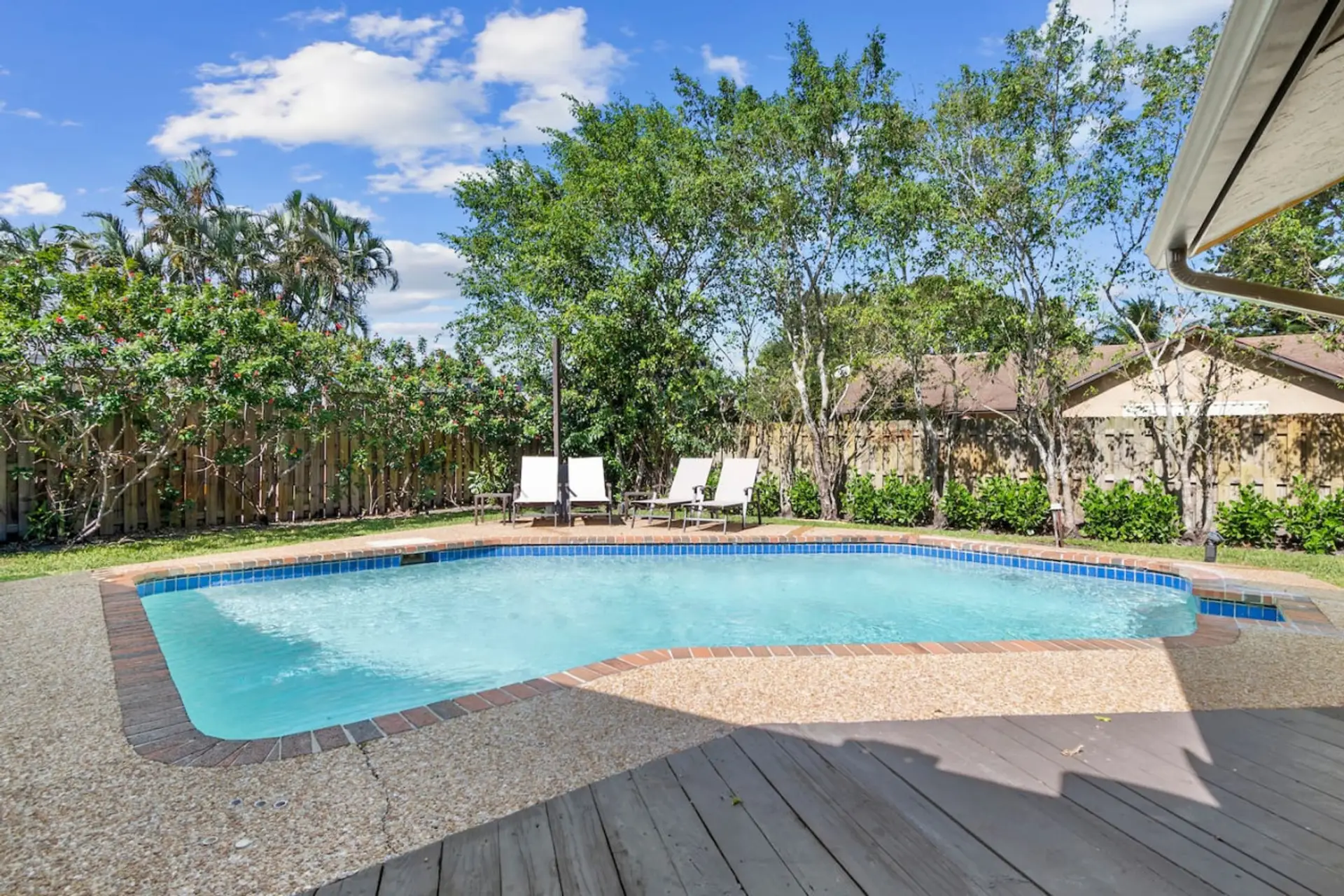 Spacious backyard with sparkling swimming pool