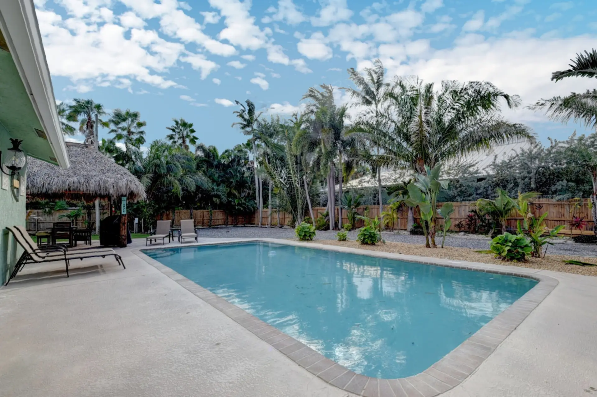 Private heated saltwater pool with tropical oasis vibes.