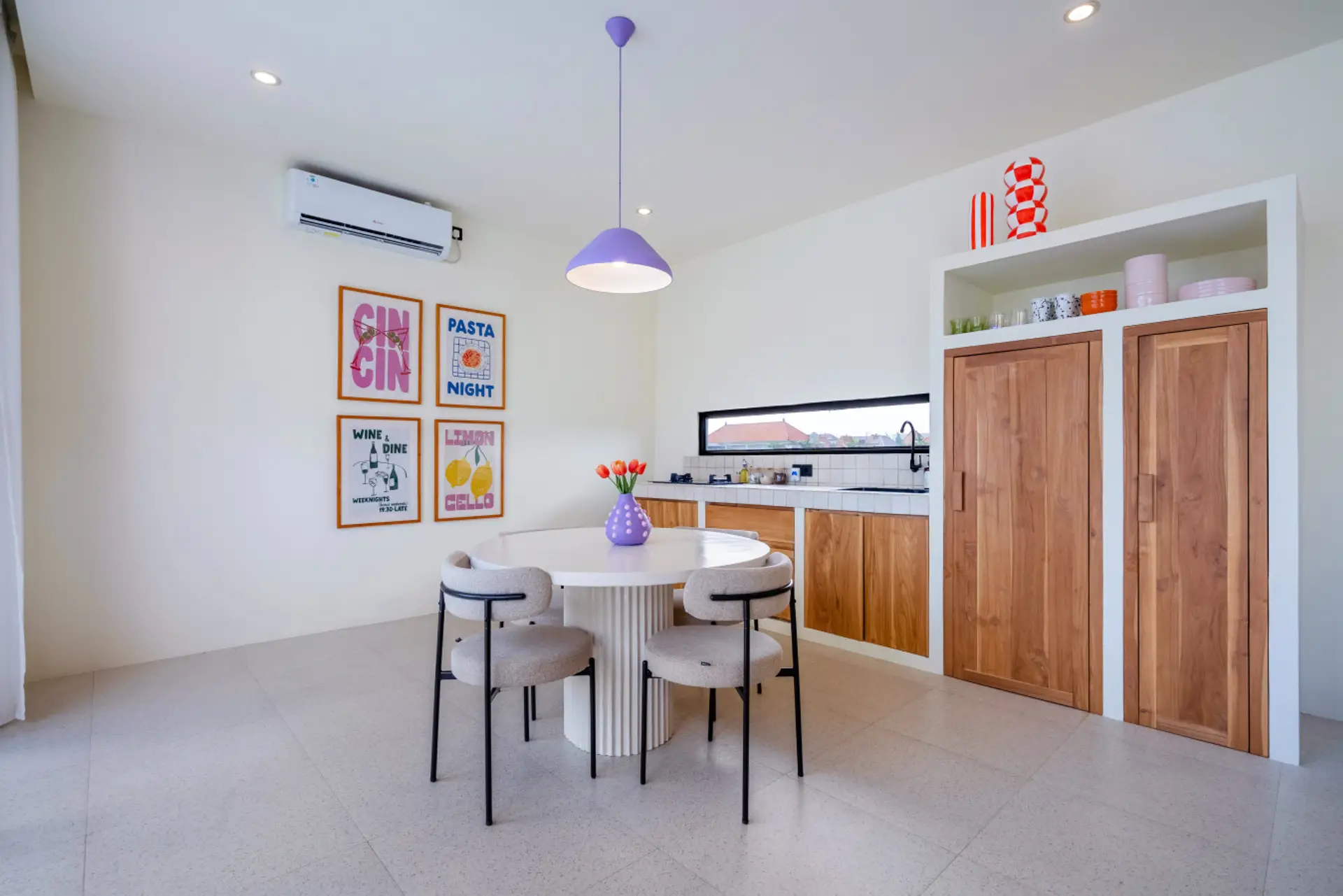 modern and brightly lit open-plan kitchen and dining area.