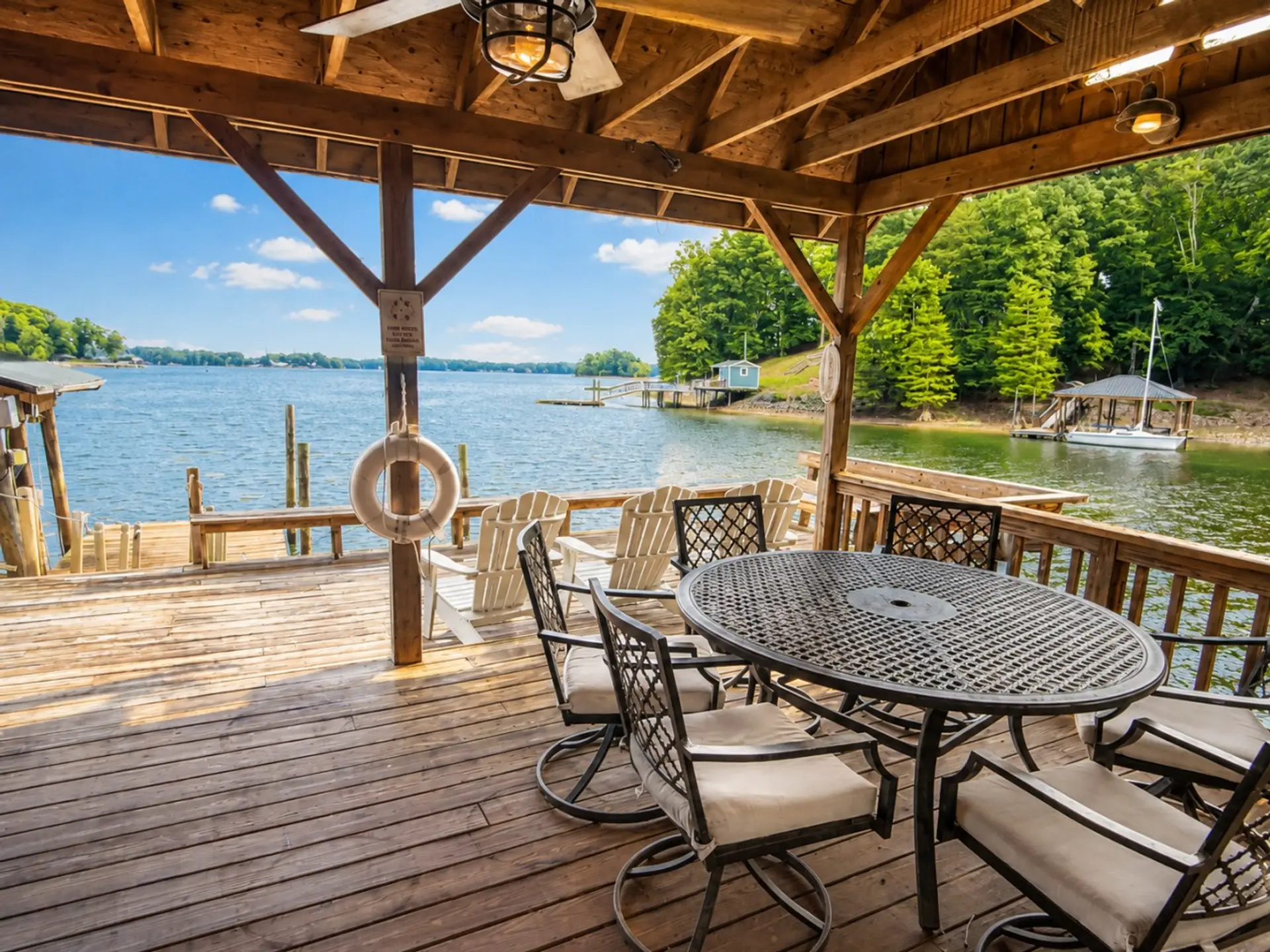 Lakeside deck with pavilion and Adirondacks
