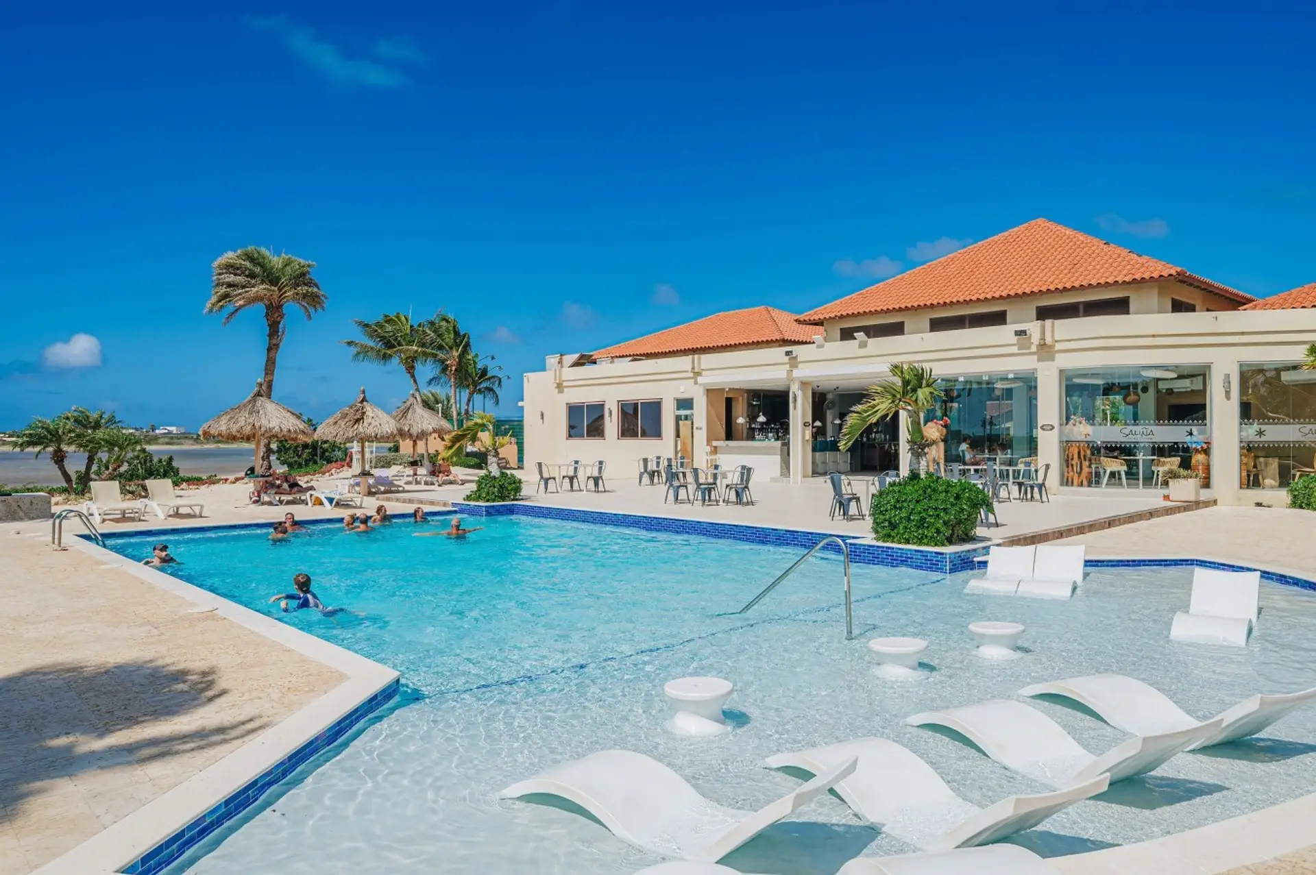 Take a refreshing swim in the Gold Coast community pool, complete with shallow lounging areas, comfortable sun chairs, and plenty of space to relax under the Aruba sun.