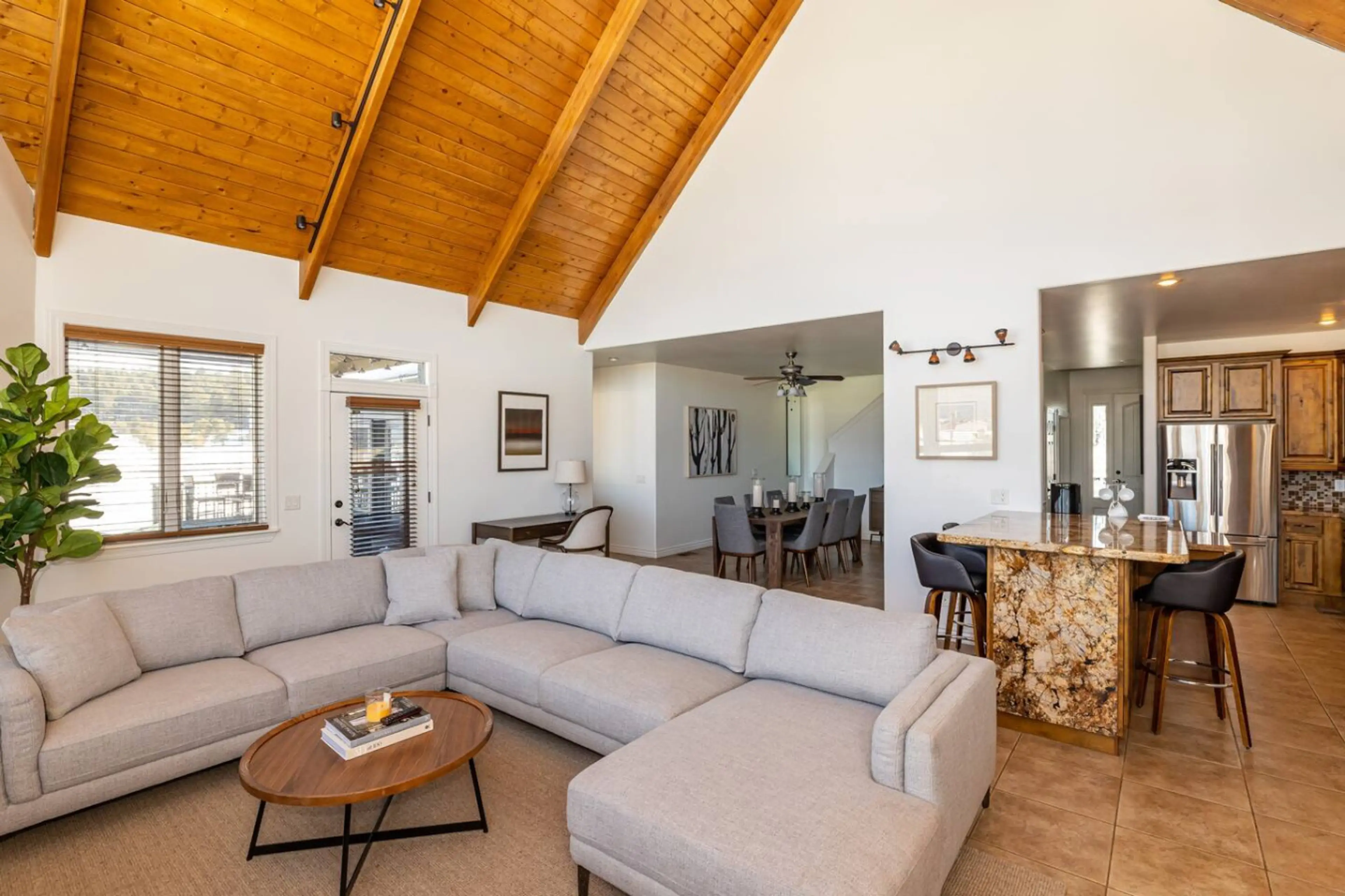 Open floor plan with living, dining, and kitchen areas