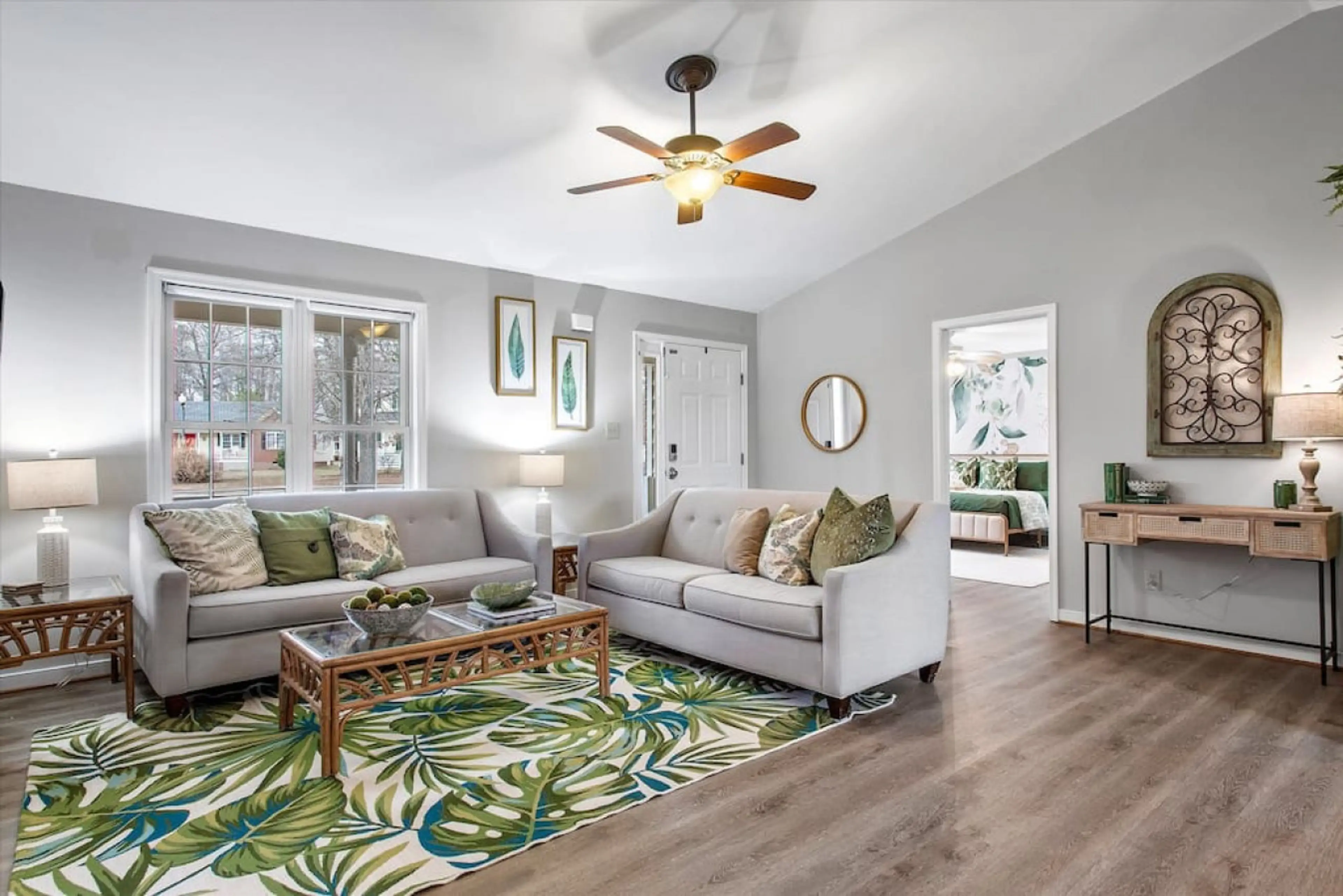 Spacious & stylish! Two comfy couches, a ceiling fan, and tons of natural light make this the perfect place to unwind. Flows seamlessly into the dining area and king bedroom.
