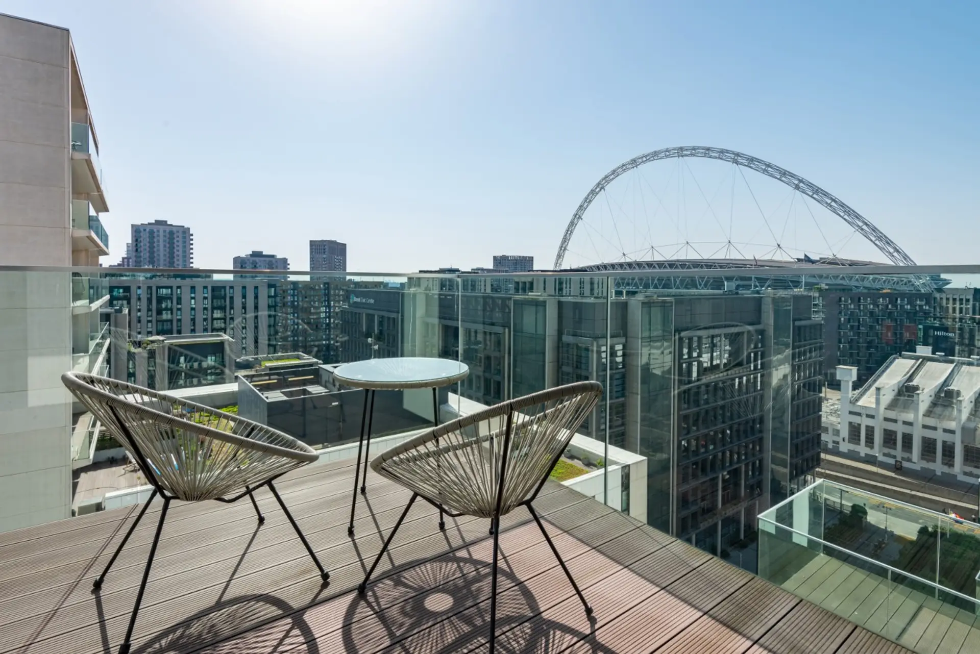 Private balcony seating with panoramic views of Wembley Stadium's iconic arch