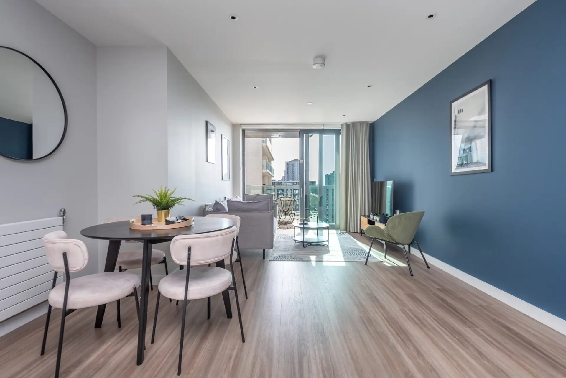 Spacious open-plan living and dining space leading to the balcony