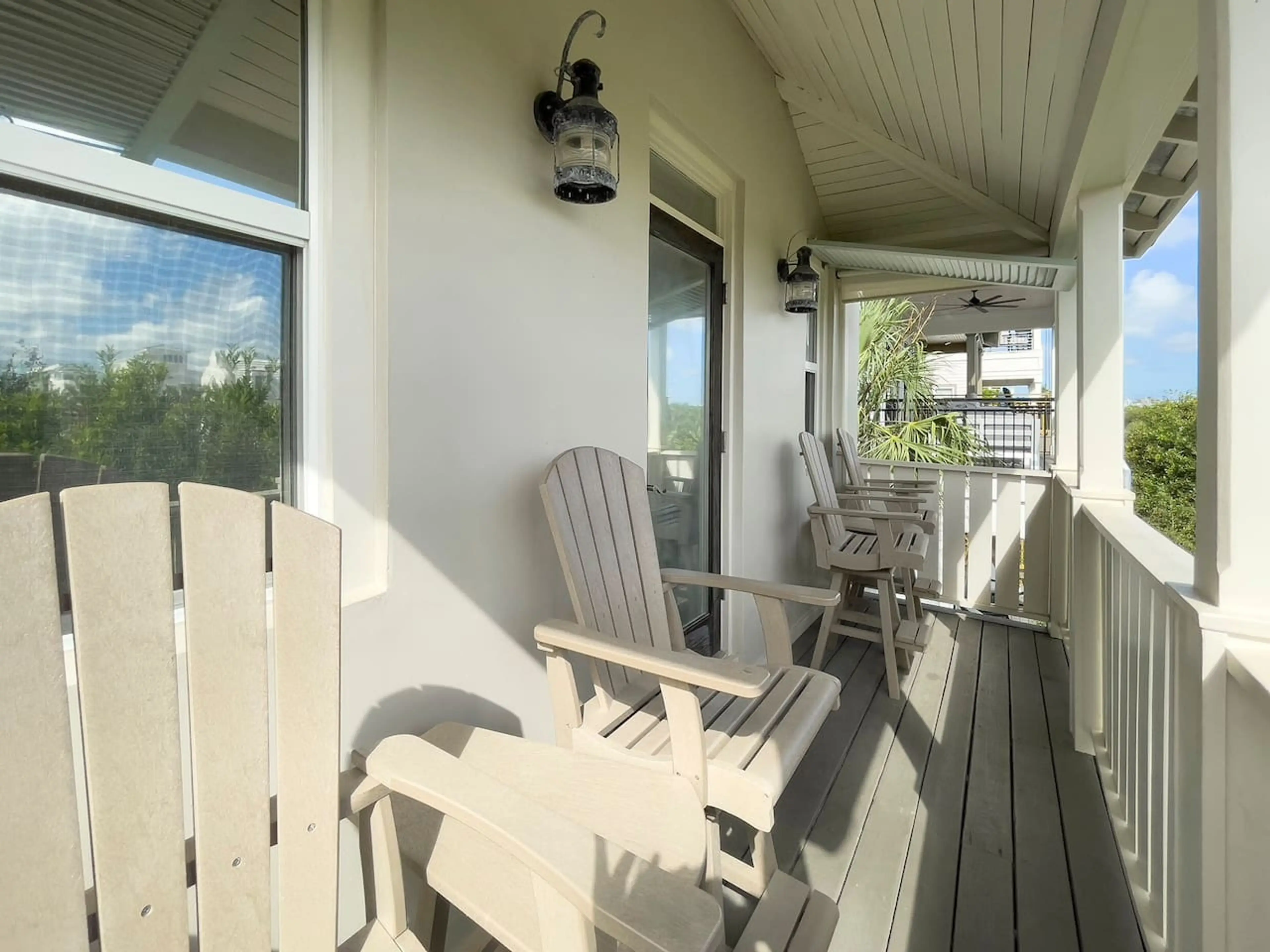 Covered deck off living area affords peek-a-boo views of the Gulf waters