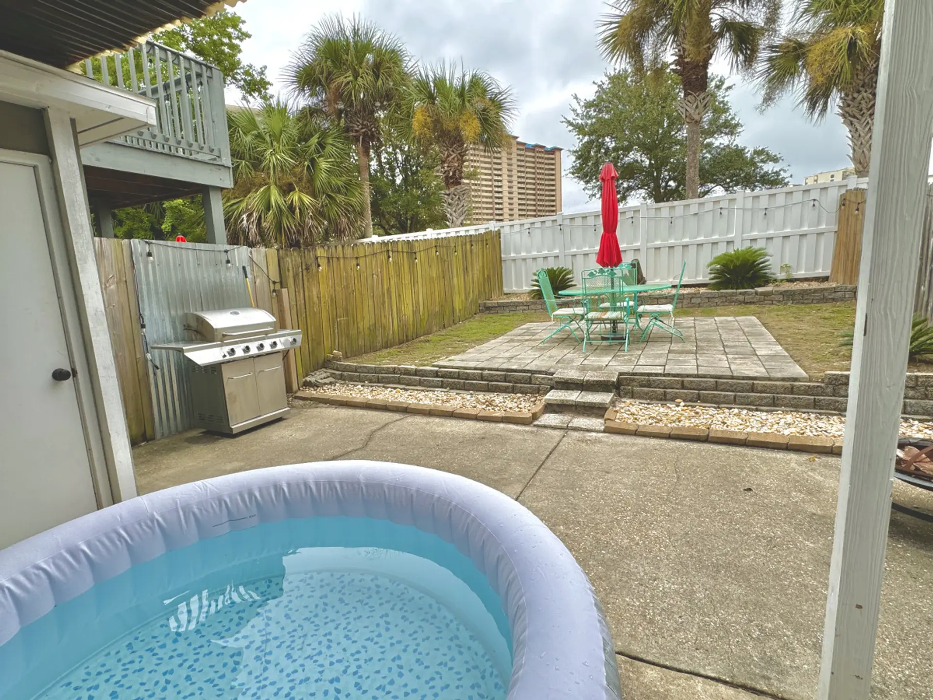 A cozy, fenced-in spot made for relaxing in the hot tub, cooking out, or enjoying each other’s company.