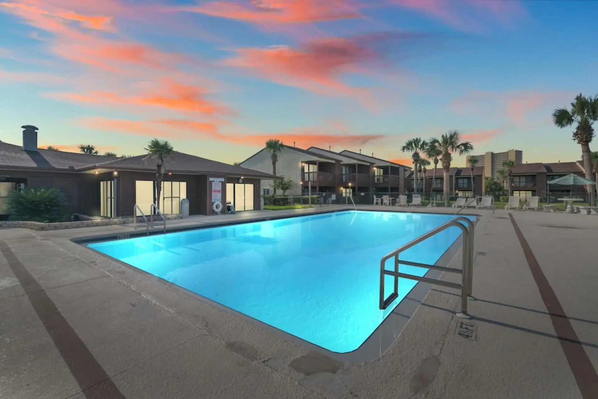 As night falls, the community pool becomes a peaceful retreat, with stars gracefully mirrored on the shimmering water, offering the perfect setting for relaxation.