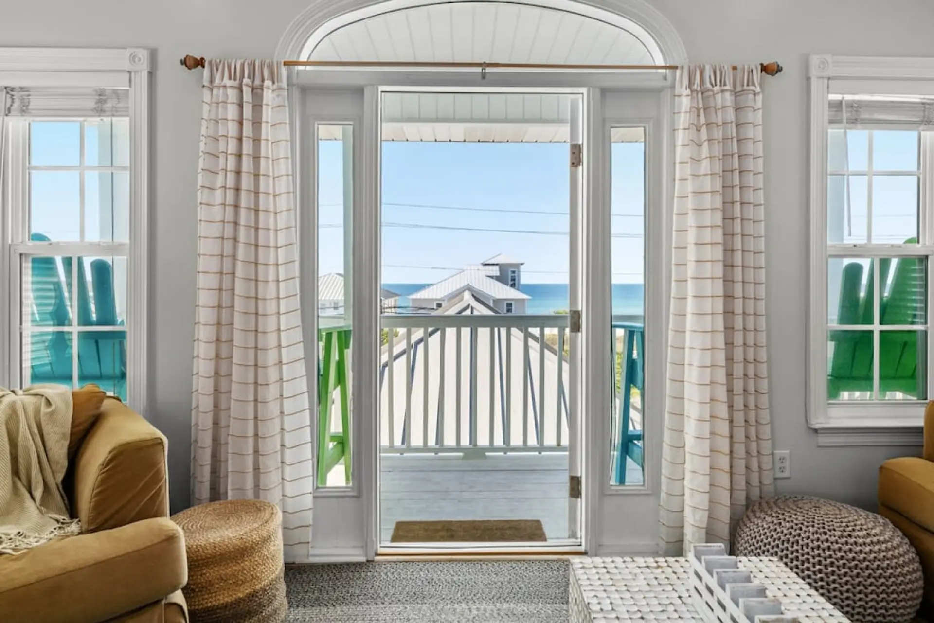 Sipping on serenity and soaking in partial views of the Gulf of Mexico from our top-floor deck