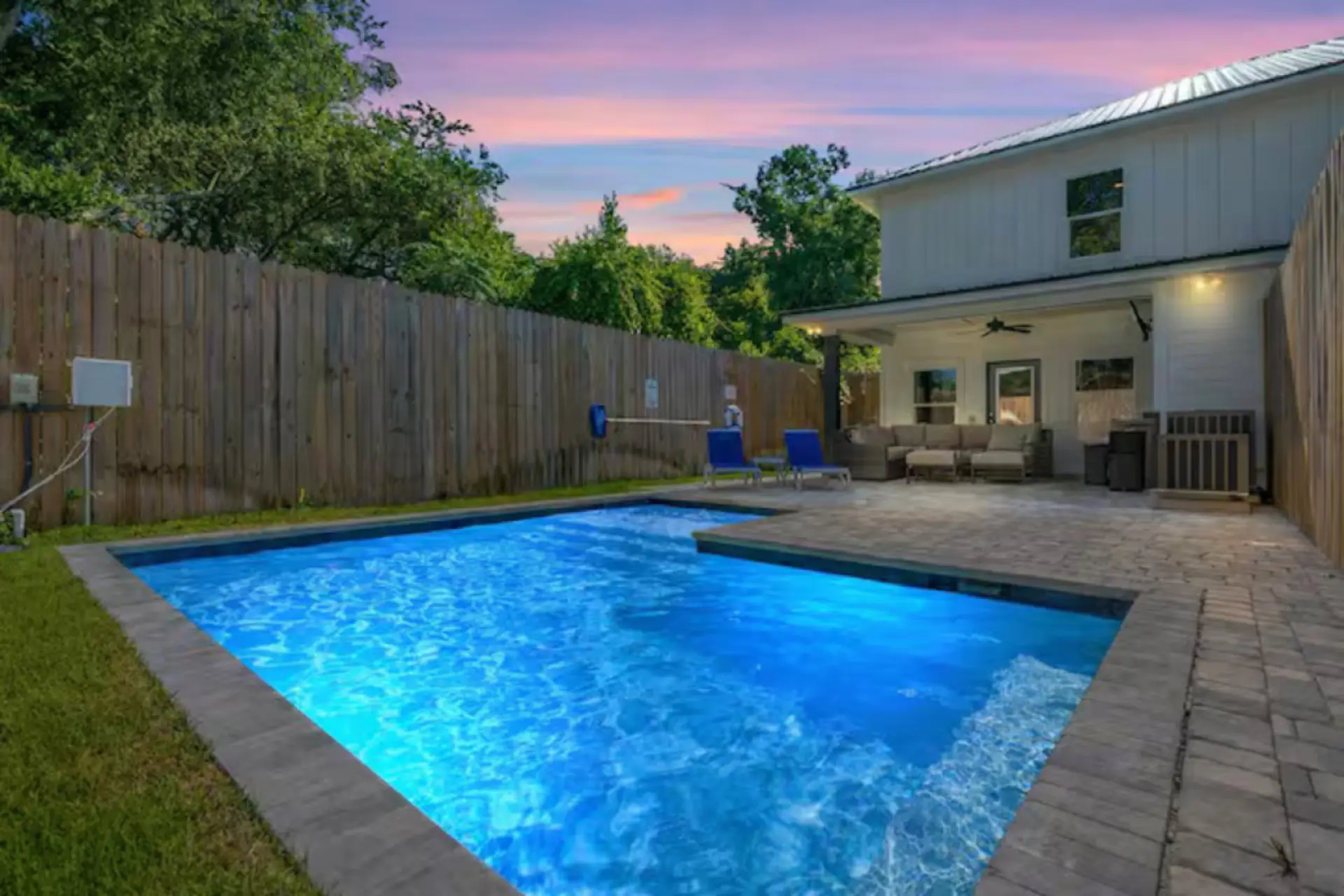 Dive into your own glowing private pool and unwind on the patio at this cozy, sunset-ready escape