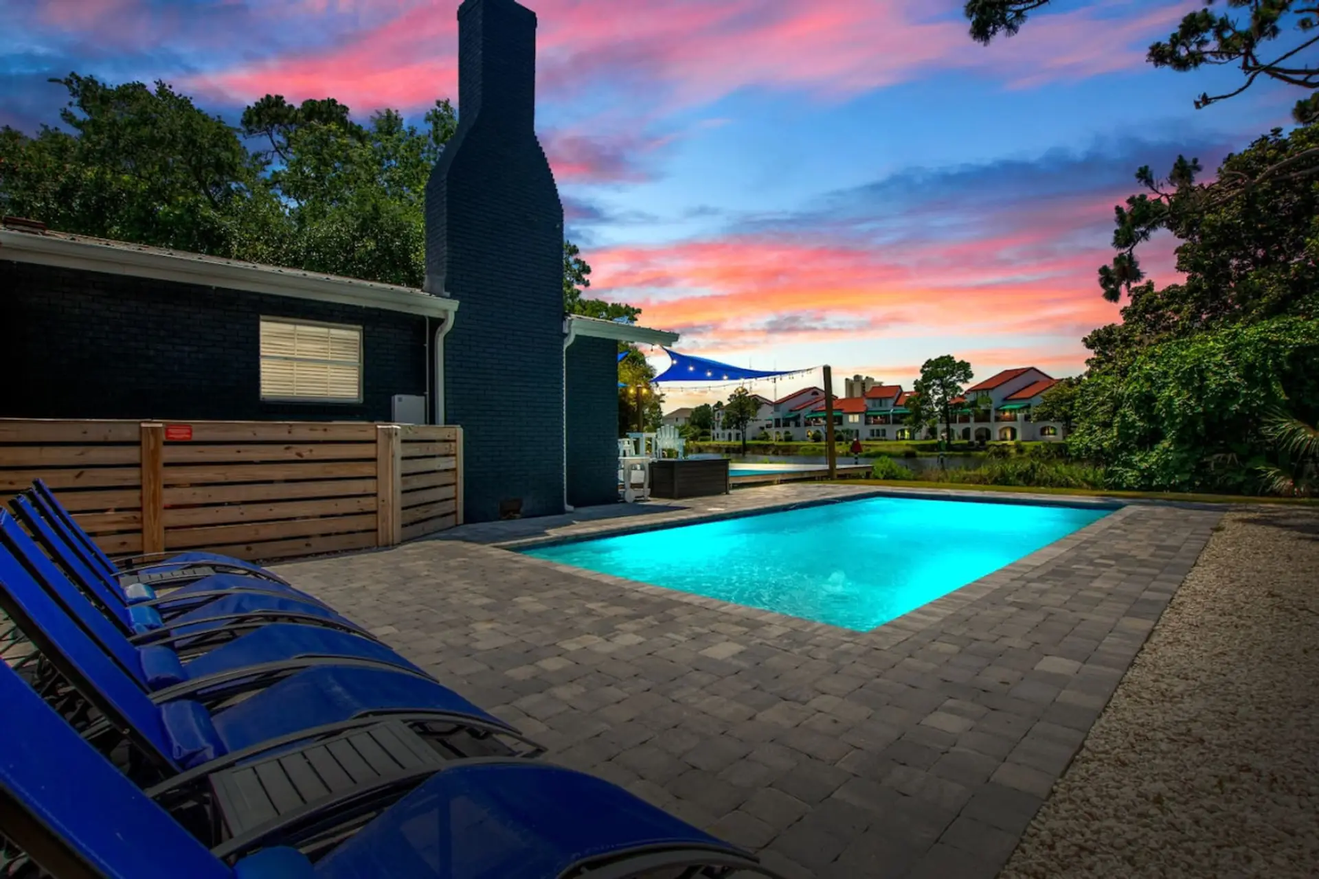 Step into Poseidon's Palace, where twilight casts a magical glow over our pool area, offering a breathtaking view of the lagoon.