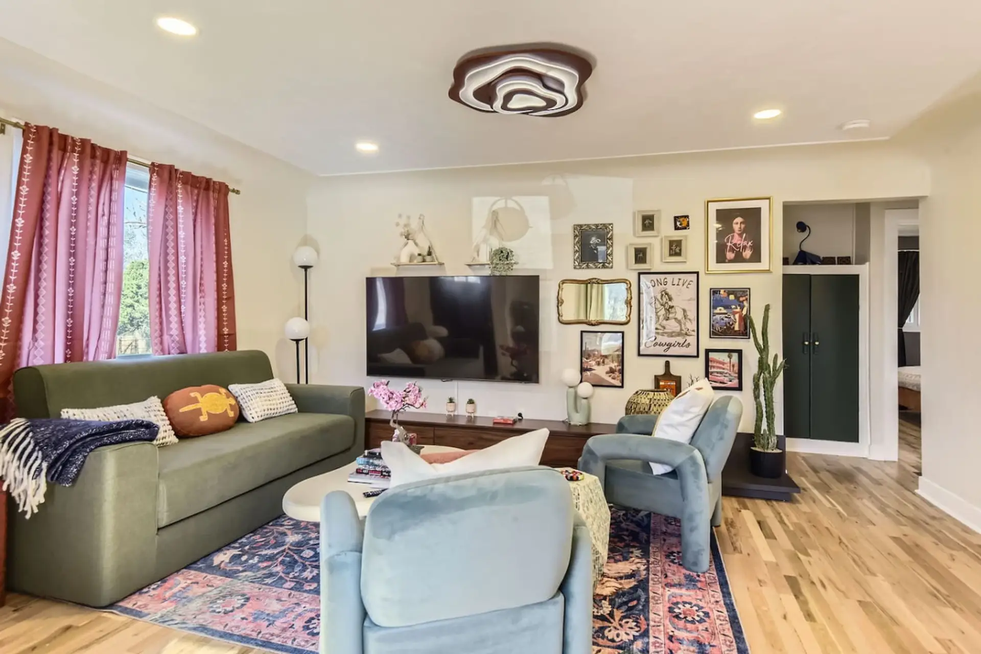 Wind down in the eclectic living room with large smart TV and comfortable seating