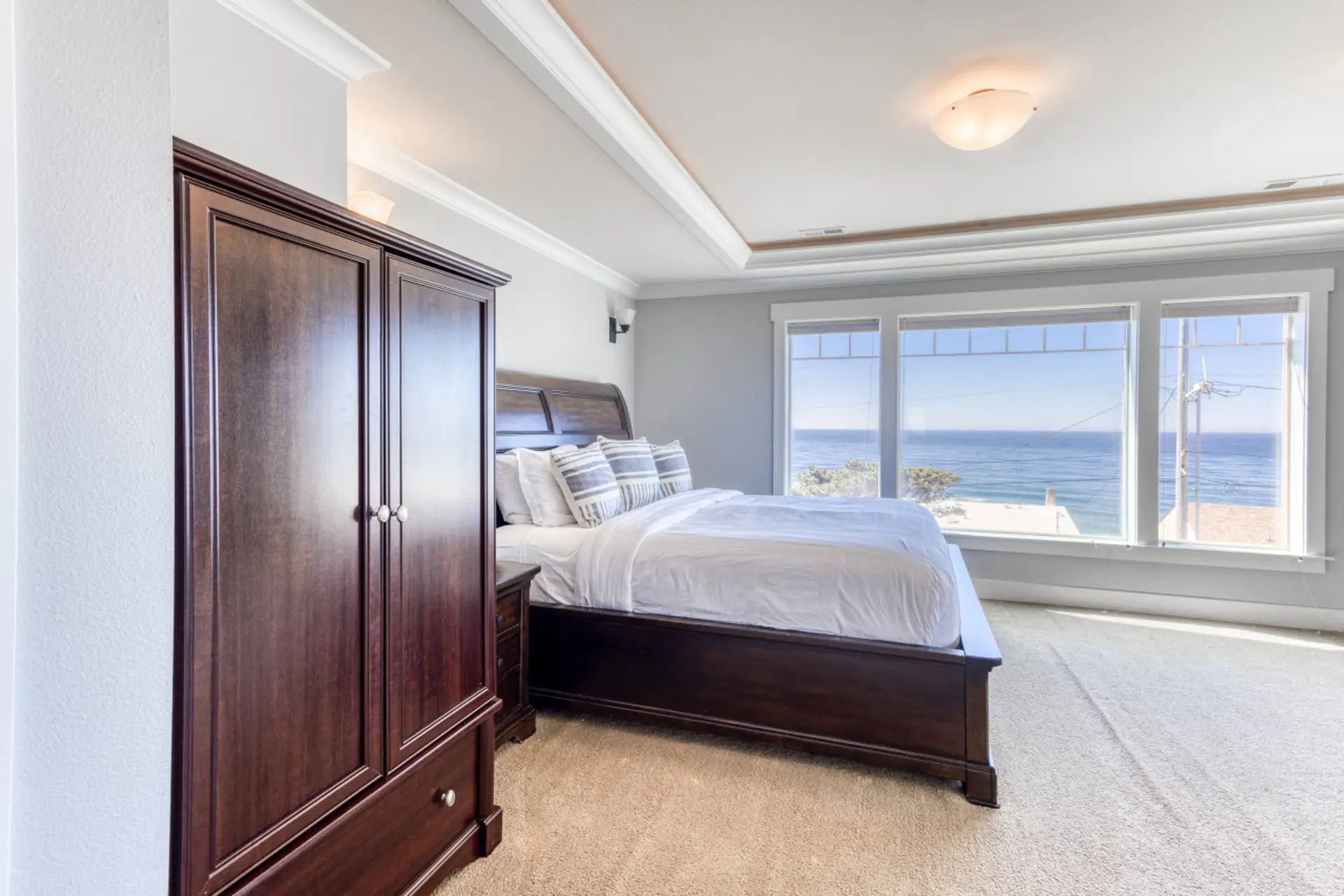 Blue Whale King Suite — king bed with the ocean out the window