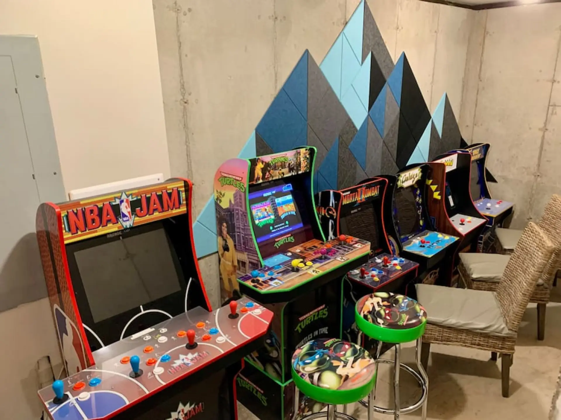 The arcade in the basement — Golden Tee, air hockey, shuffleboard, and hoops, so rainy days are covered