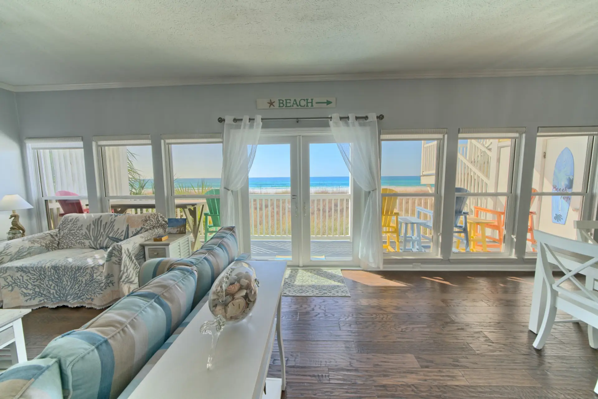 Bright and breezy, this living space invites you to relax with panoramic ocean views just steps away