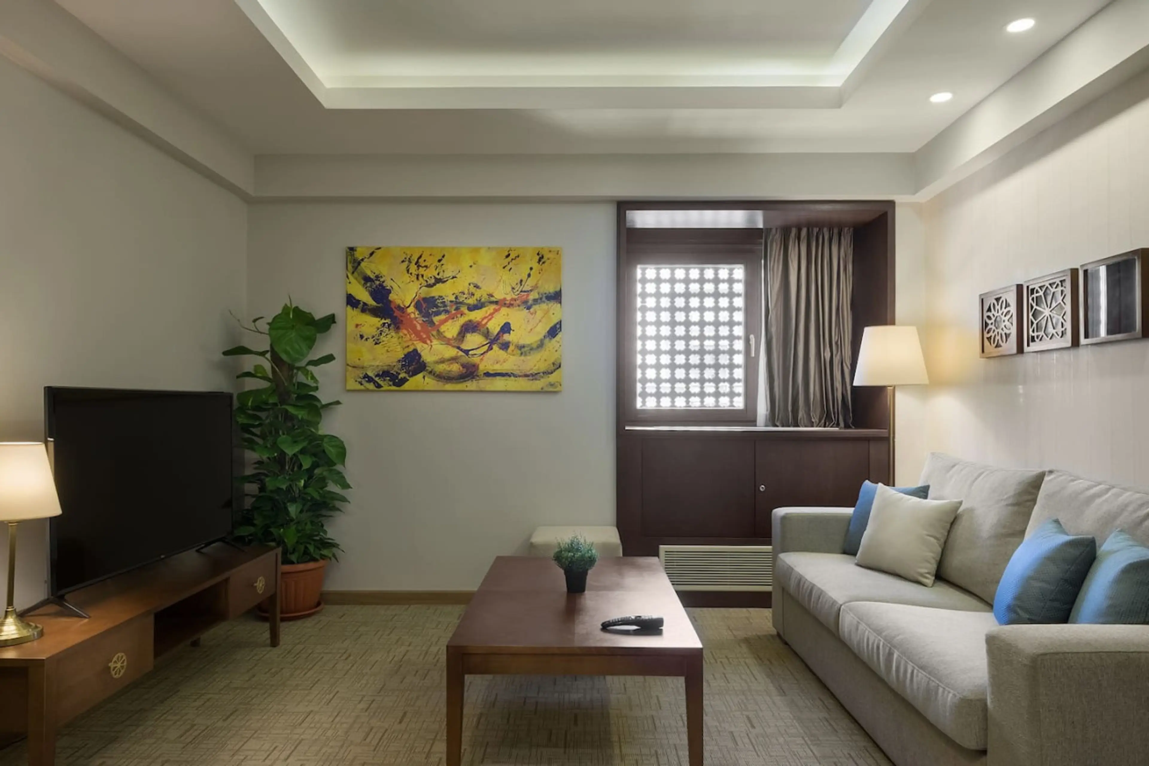 Your cozy corner! A comfy sofa bed and a Smart TV—all bathed in natural light from the window.