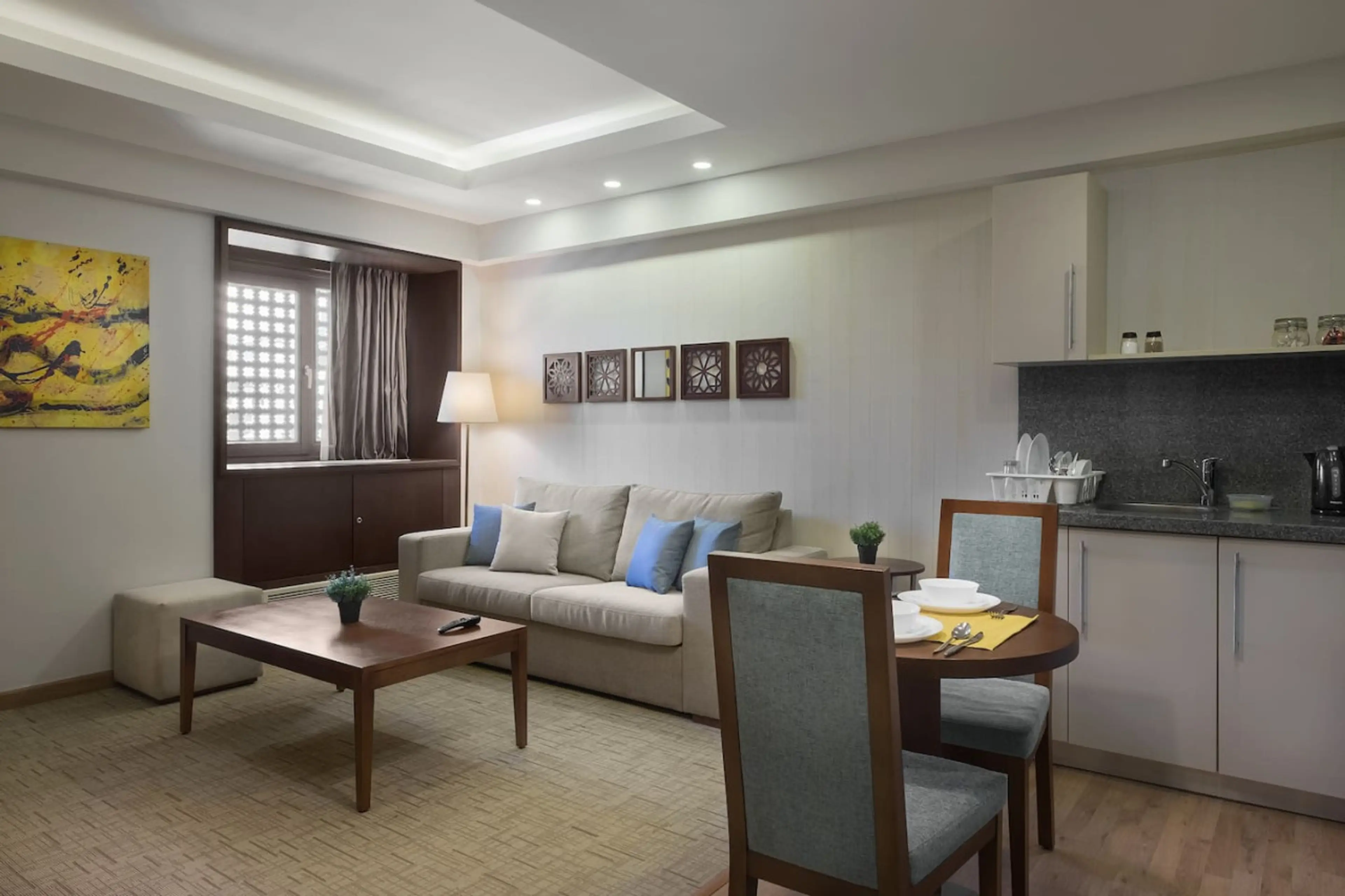 Open, airy, and connected! The living room flows effortlessly into the dining area, with a touch of greenery.