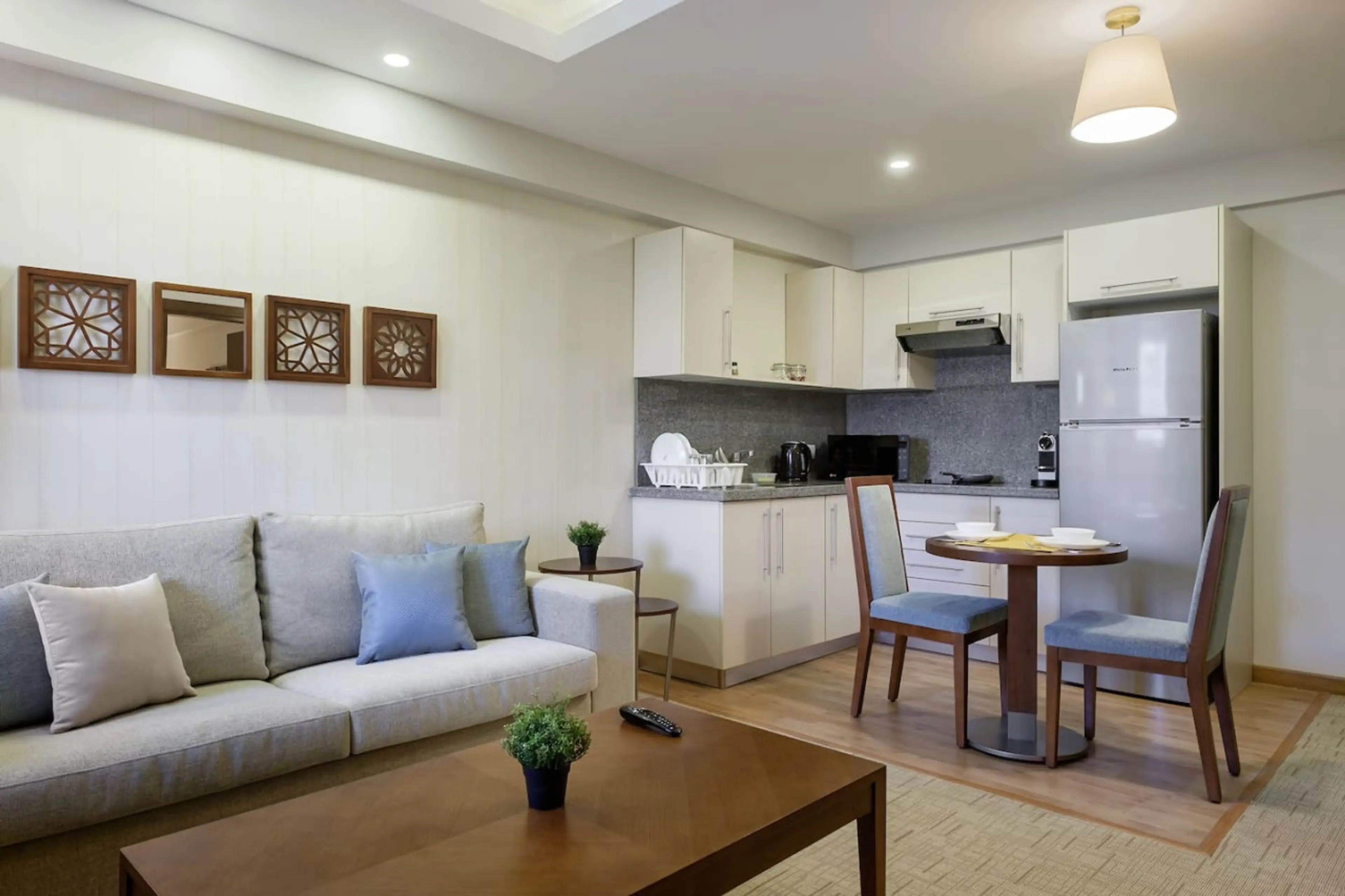 Open, airy, and connected! The living room flows effortlessly into the dining area, with a touch of greenery.