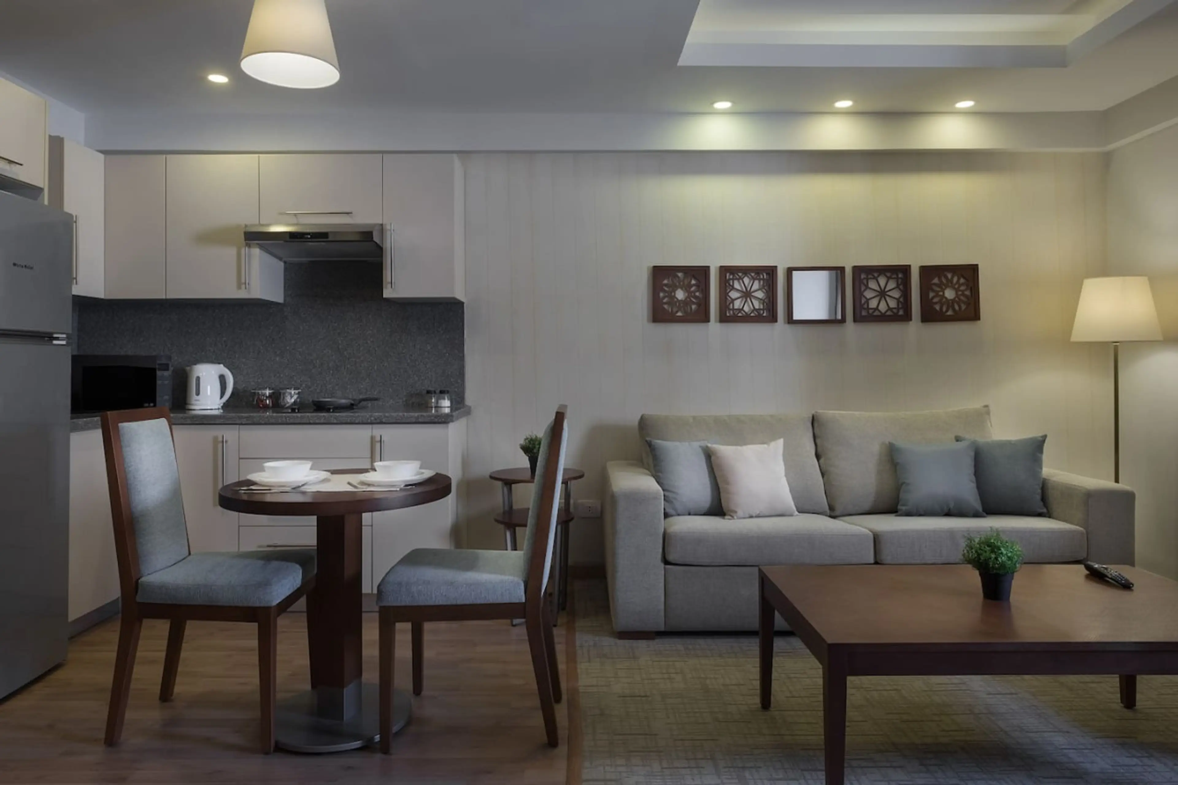 Open, airy, and connected! The living room flows effortlessly into the dining area, with a touch of greenery.