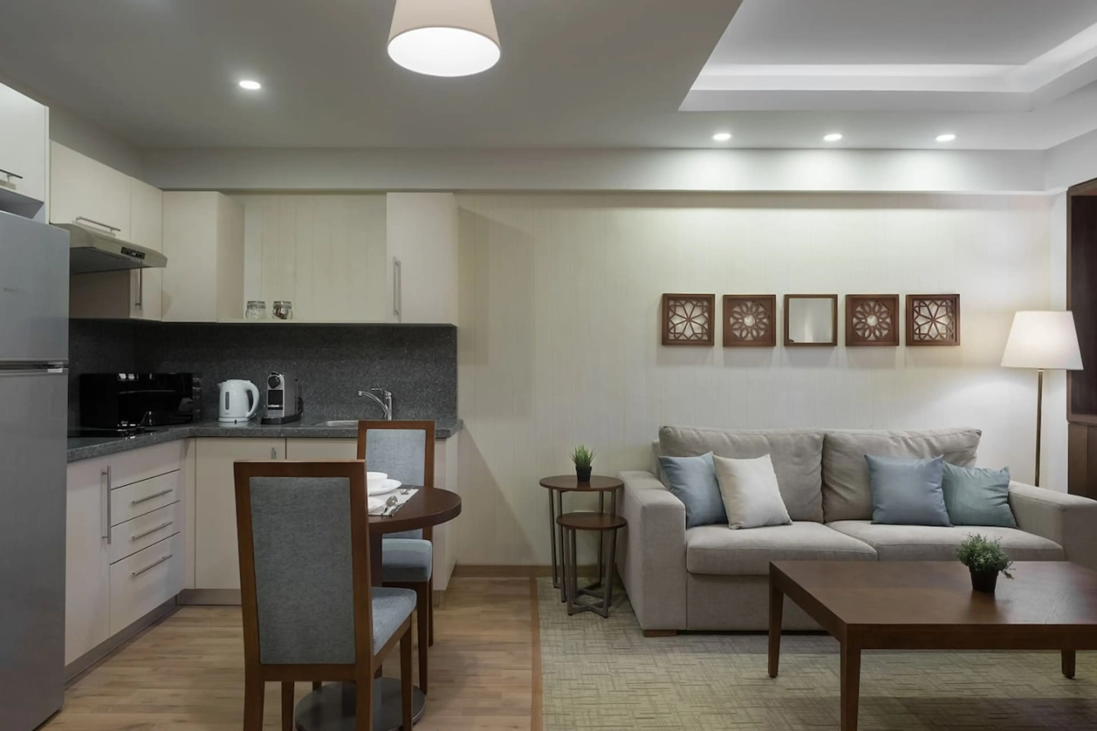 Open, airy, and connected! The living room flows effortlessly into the dining area, with a touch of greenery.