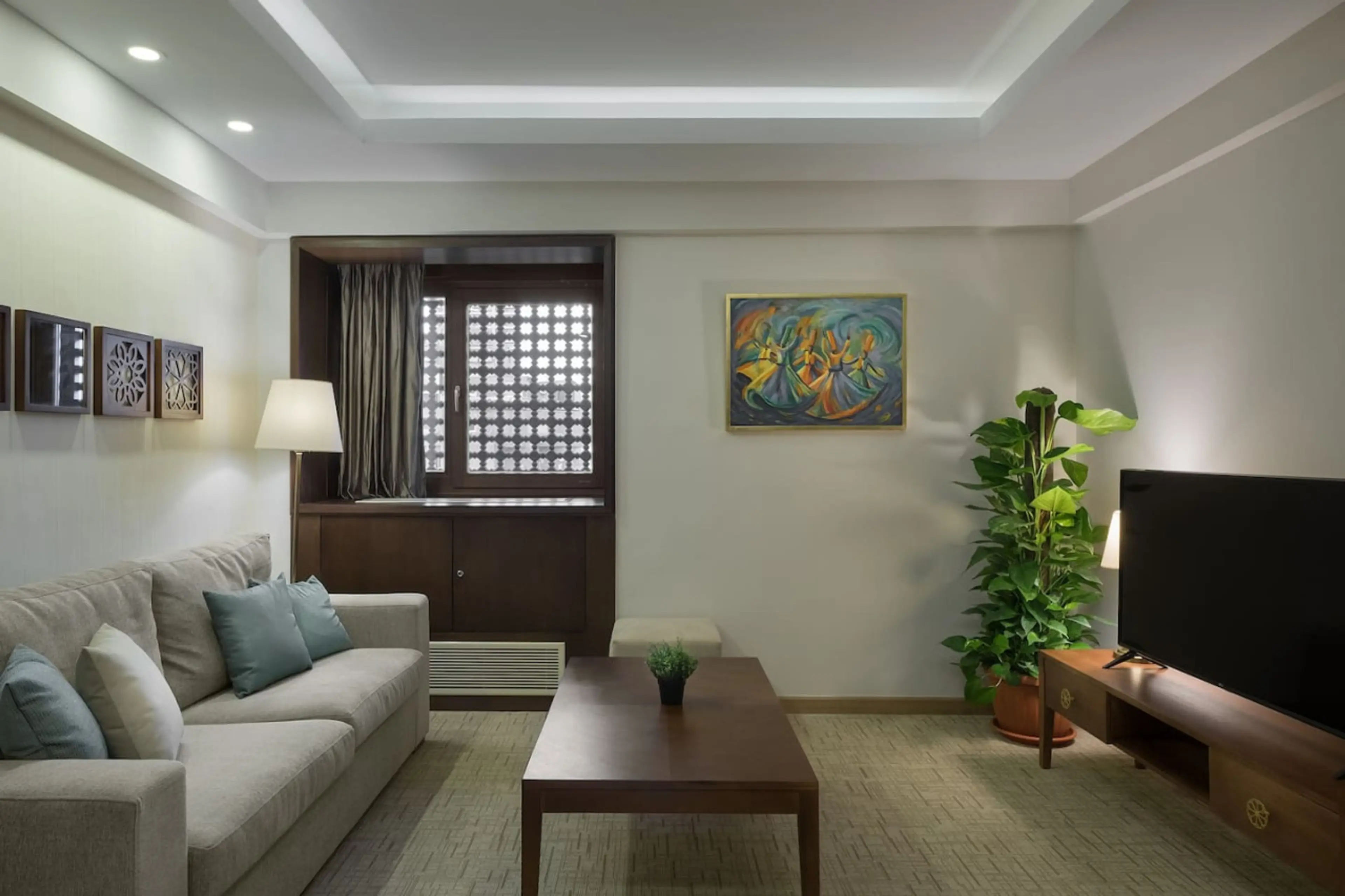 Your cozy corner! A comfy sofa bed and a Smart TV—all bathed in natural light from the window.