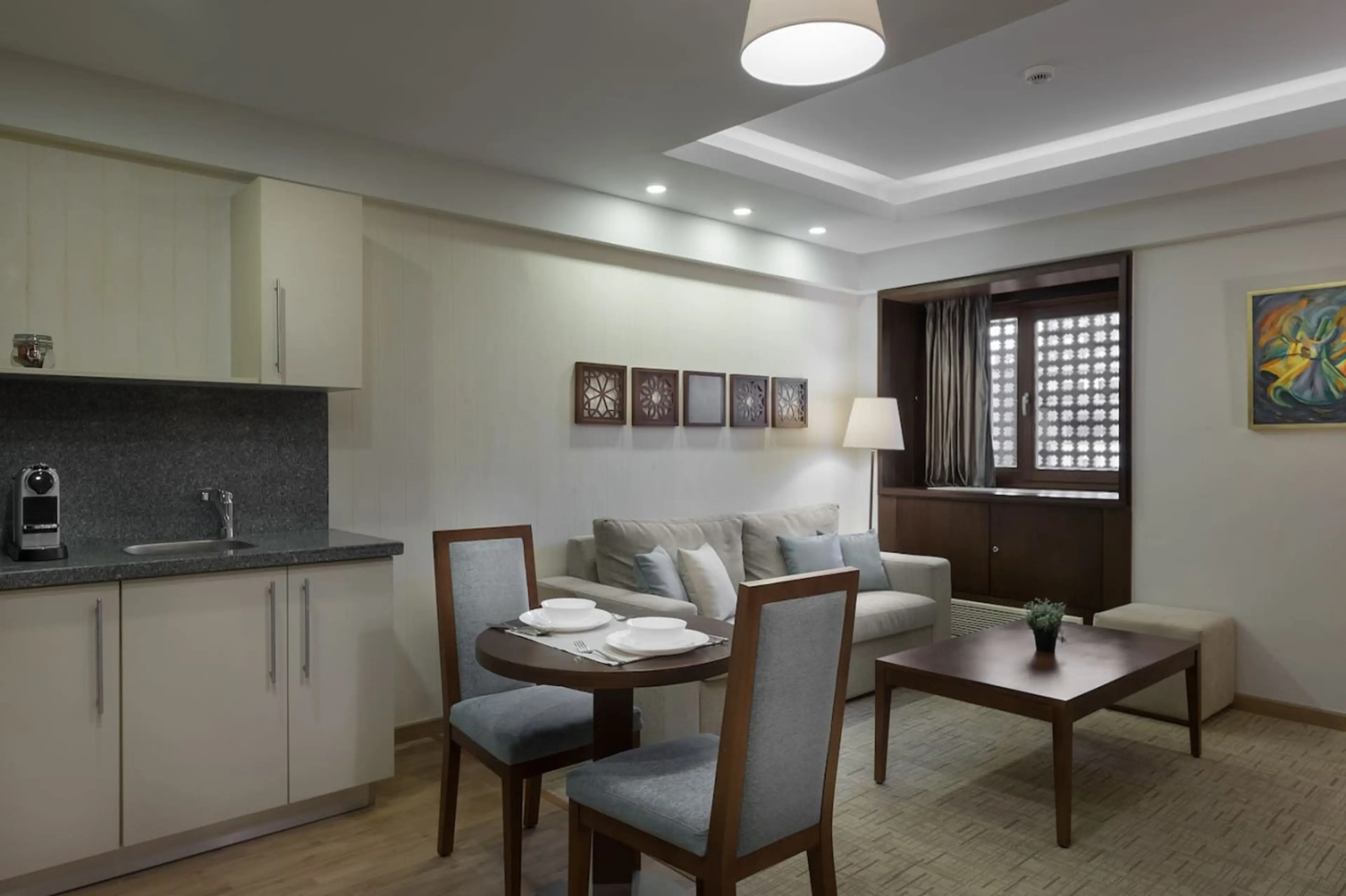 Open, airy, and connected! The living room flows effortlessly into the dining area, with a touch of greenery.