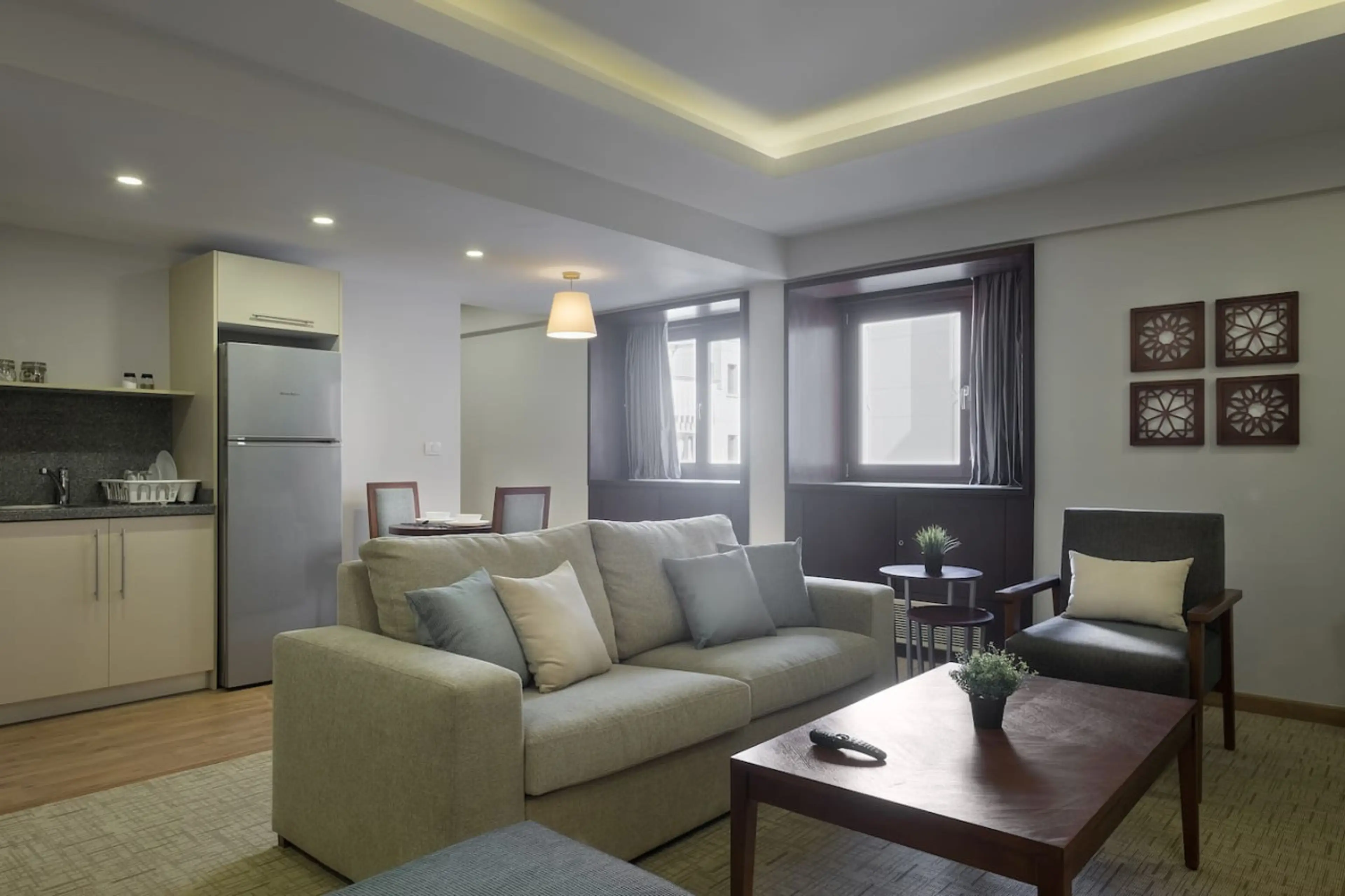 Open, airy, and connected! The living room flows effortlessly into the dining area, with a touch of greenery.