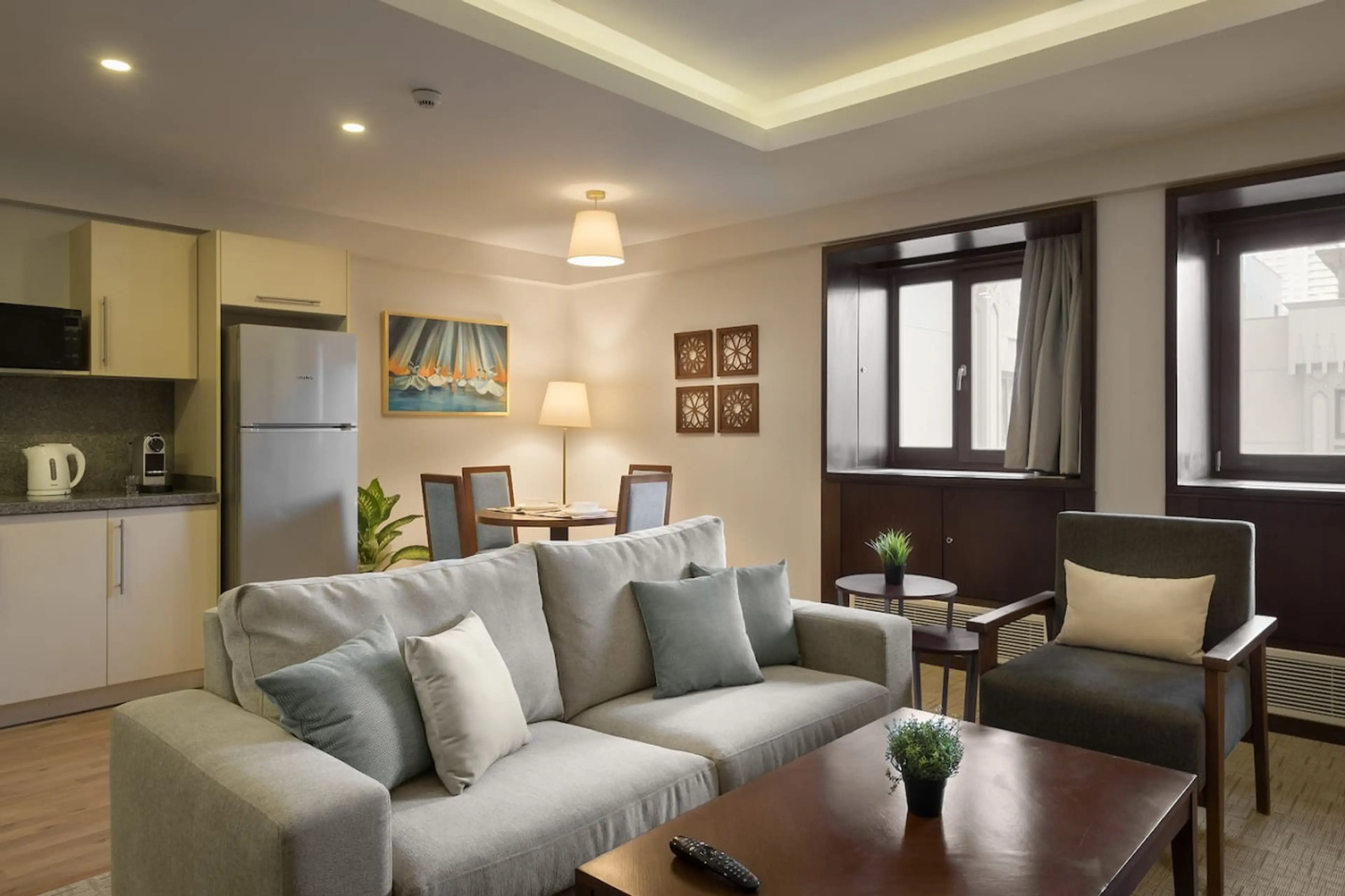 Ready for meals! A set dining table and a kitchen eager for your culinary magic.