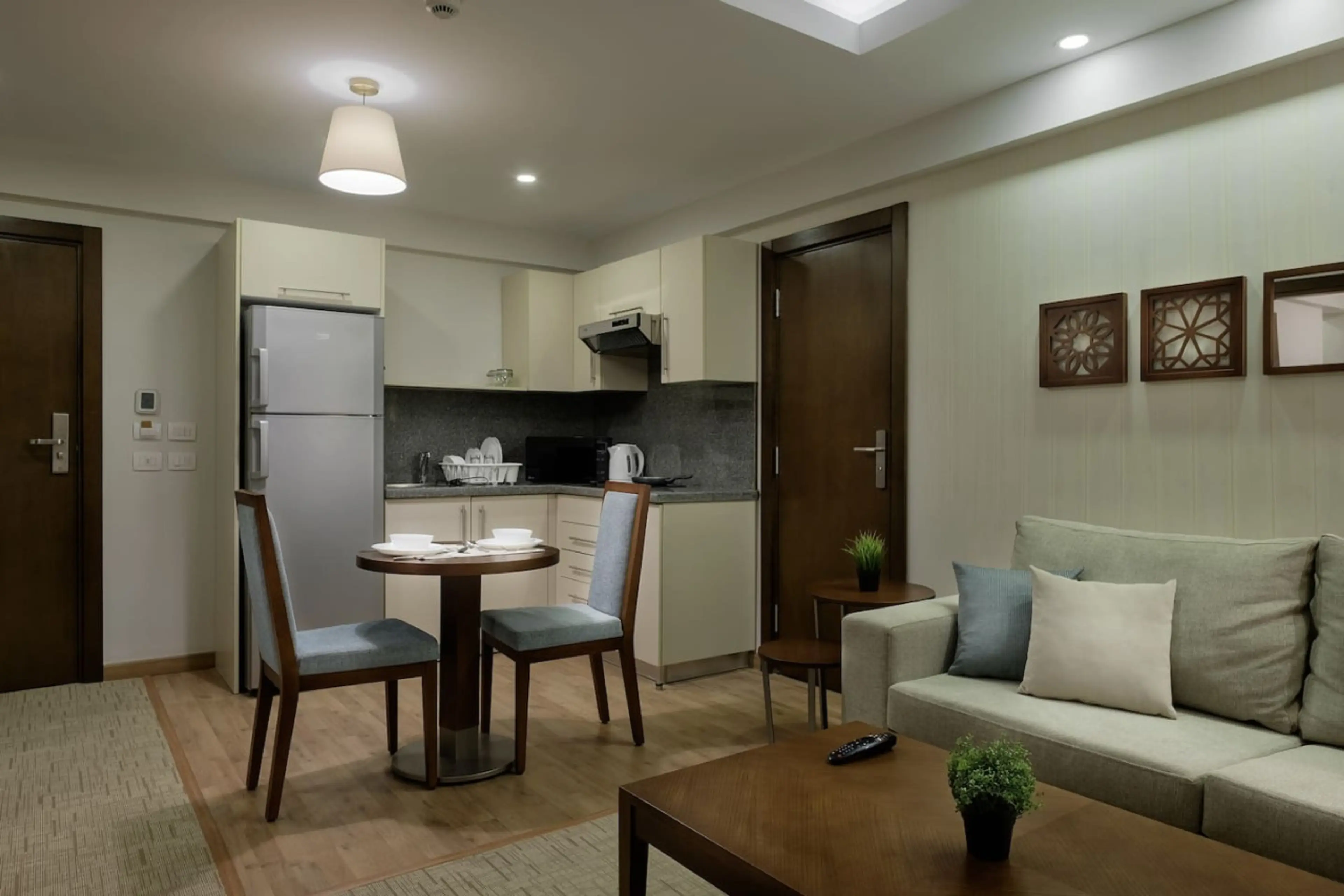 Ready for meals! A set dining table and a kitchen eager for your culinary magic.