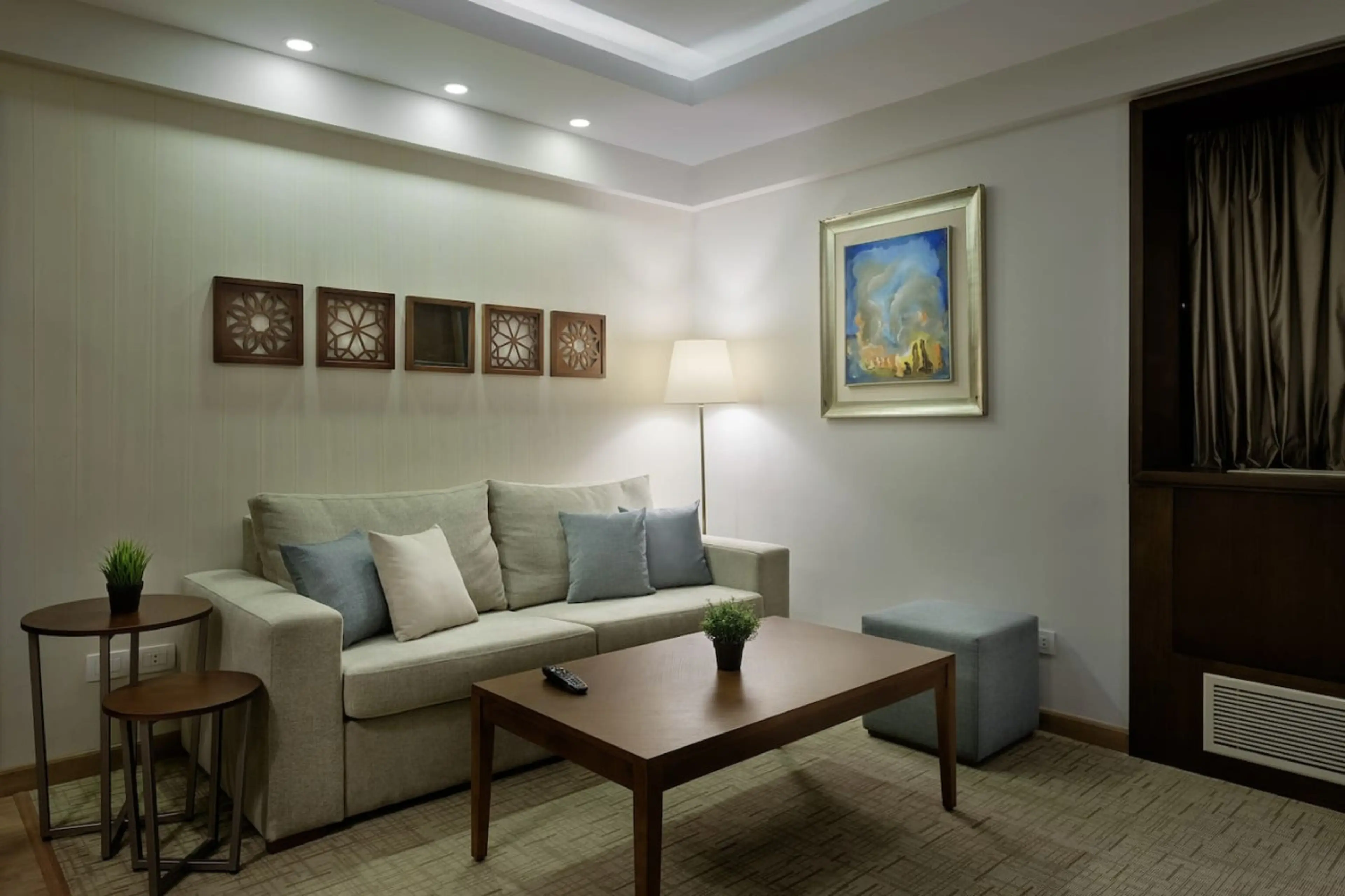 Cozy up in the living room—Arabesque art adds charm to your chill time.