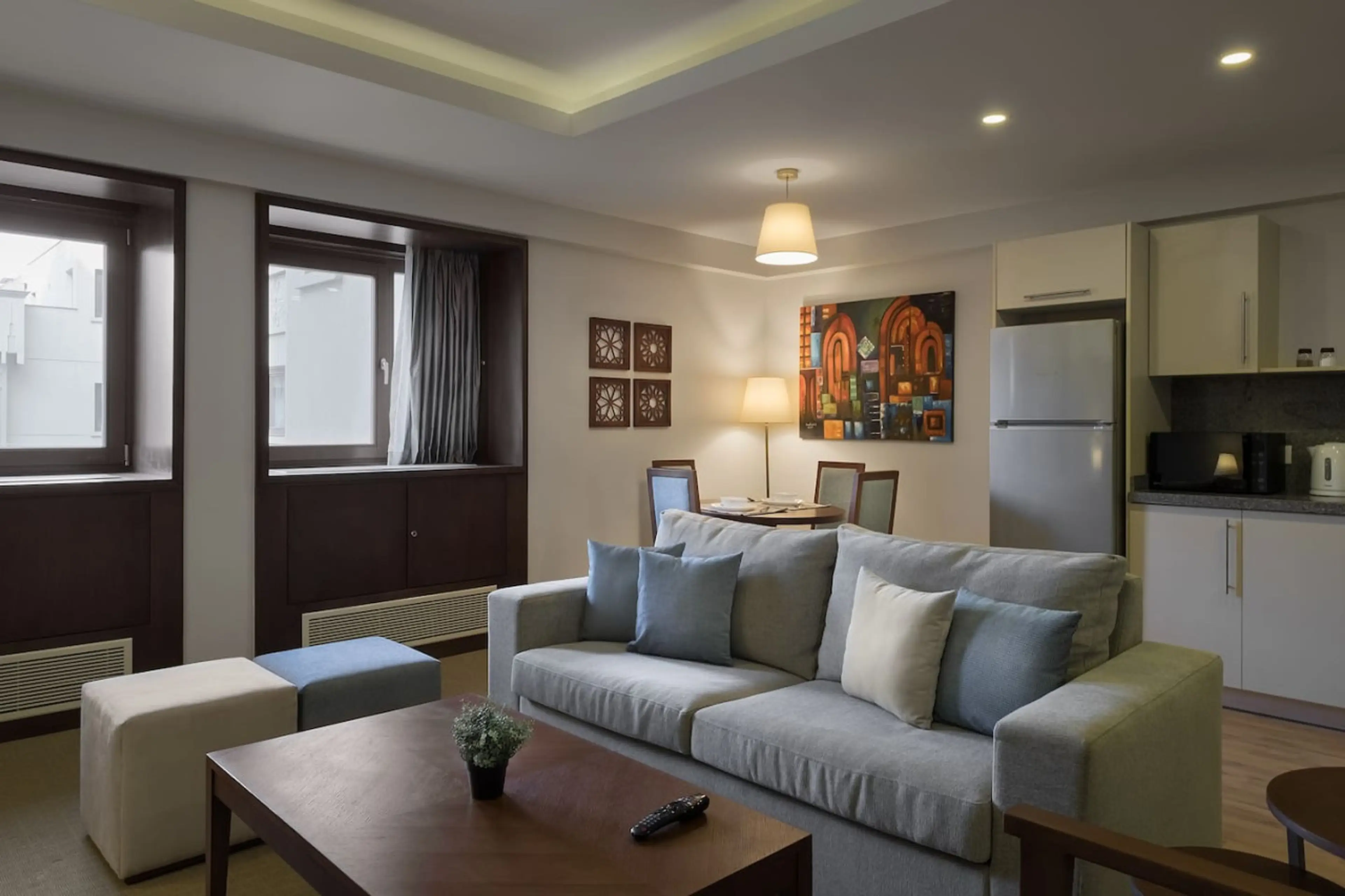 Open, airy, and connected! The living room flows effortlessly into the dining area, with a touch of greenery.
